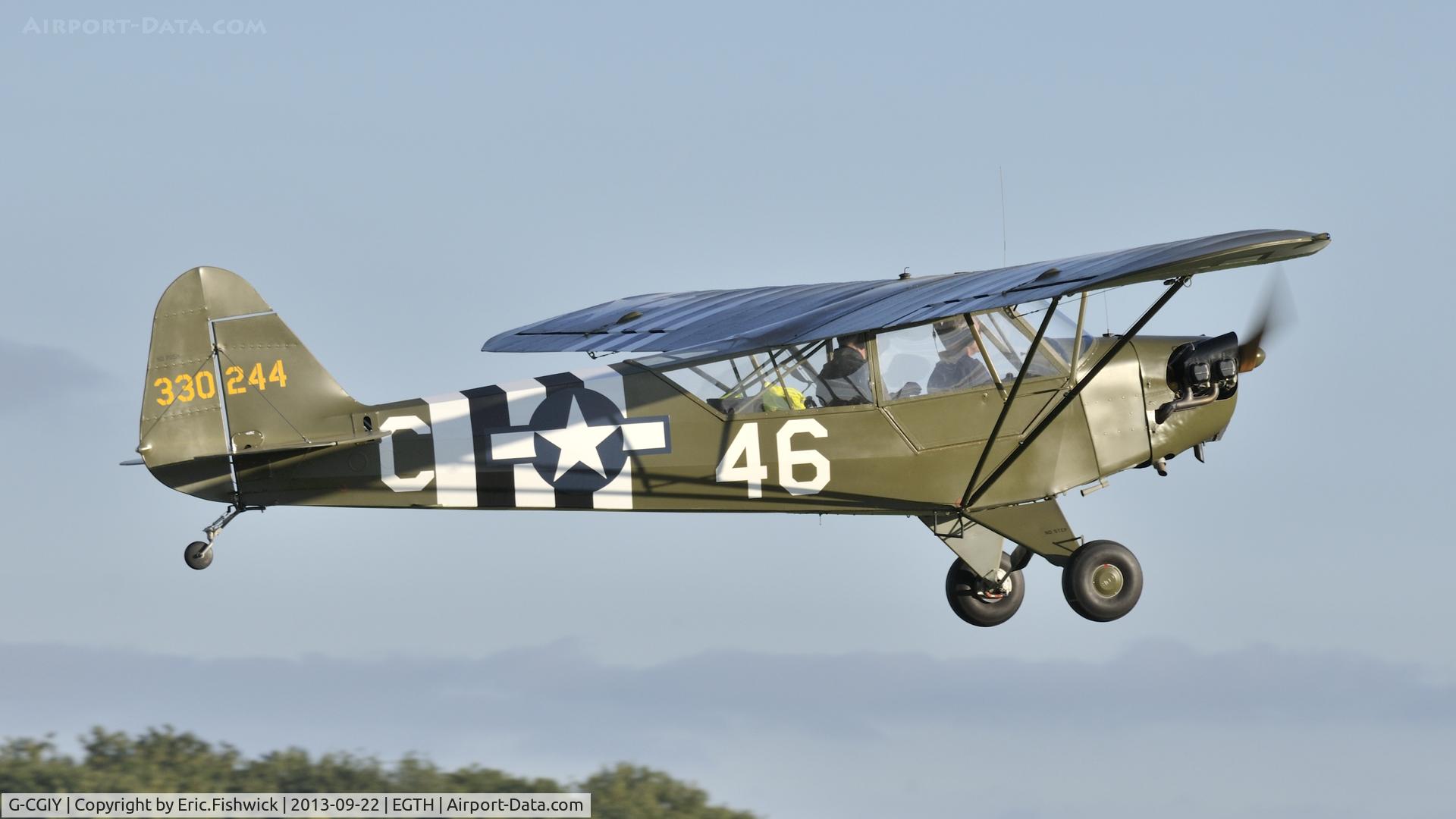 G-CGIY, 1943 Piper L-4H Grasshopper (J3C-65D) C/N 11535, 42. 330244 departing the Shuttleworth Uncovered Air Display, Sept. 2013