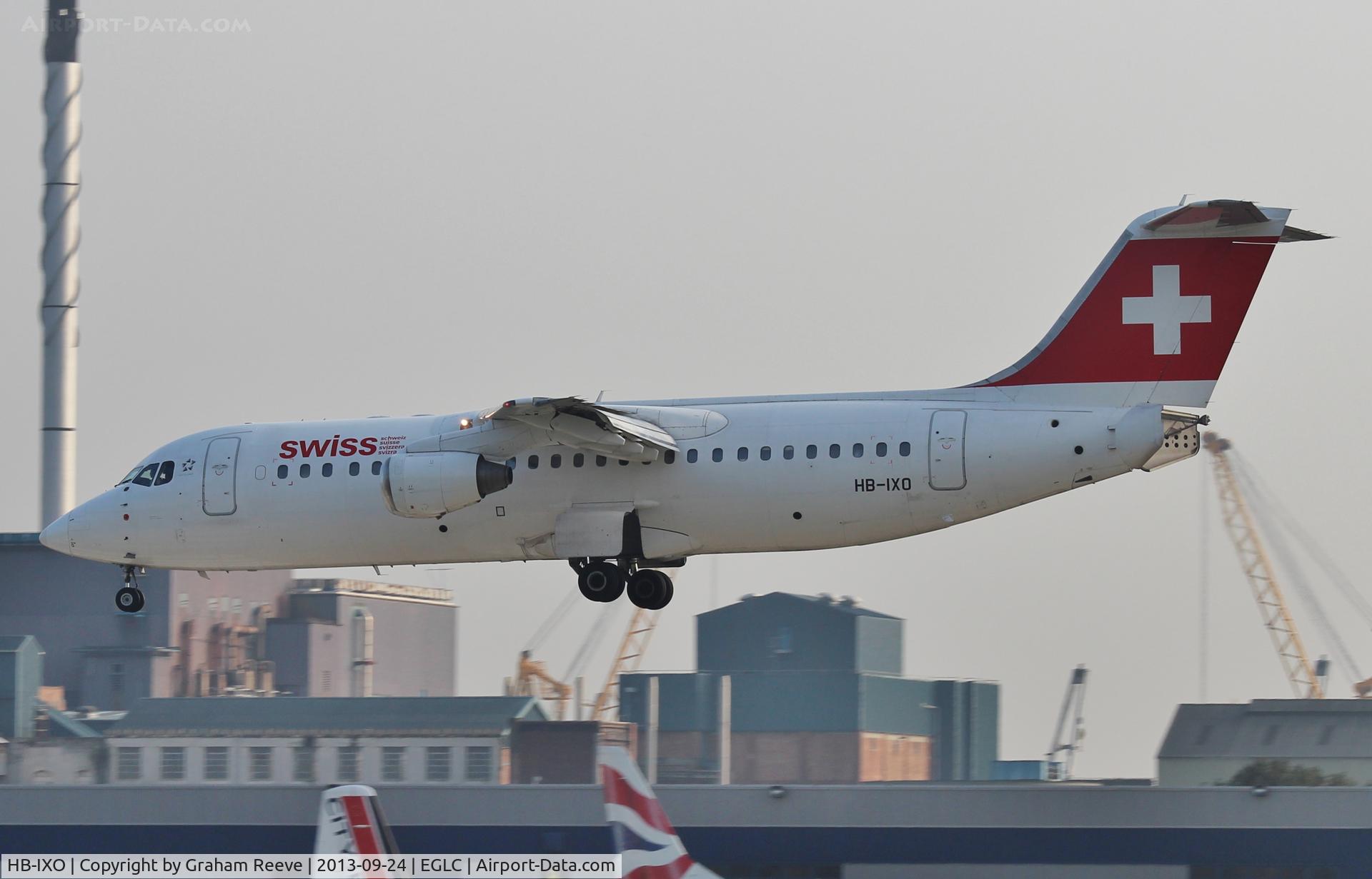 HB-IXO, 1996 British Aerospace Avro 146-RJ100 C/N E3284, bout to touch down.
