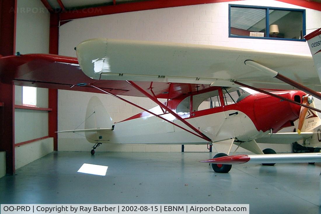 OO-PRD, Piper PA-12 Super Cruiser C/N 12-1449, Piper PA-12 Super Cruiser [12-1449] Namur-Temploux-Suarlee~OO 15/08/2002. Unmarked when this was taken registered N93AG approx 5 months later. Tucked away in the back of the hangar.