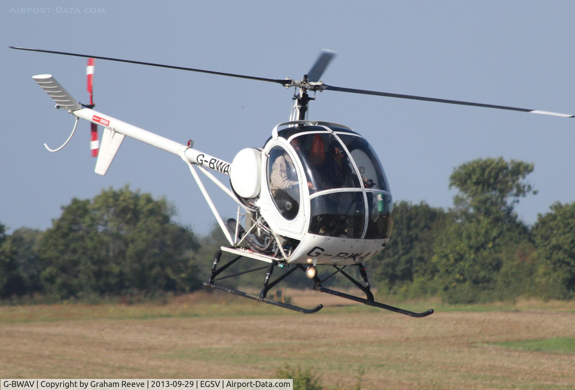 G-BWAV, 1985 Schweizer 269C C/N S-1204, Landing at Old Buckenham for 