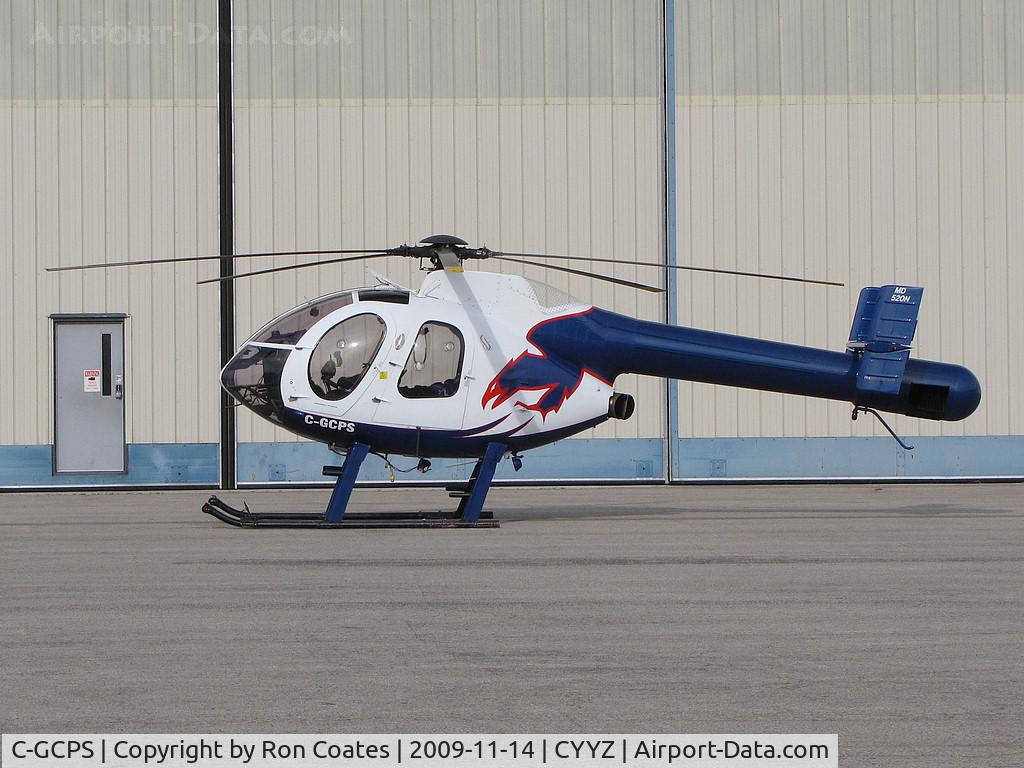 C-GCPS, 1991 McDonnell Douglas 500N C/N LN024, This 1991 MD 520N sits lonely outside the hangers at Toronto Int'l Airport