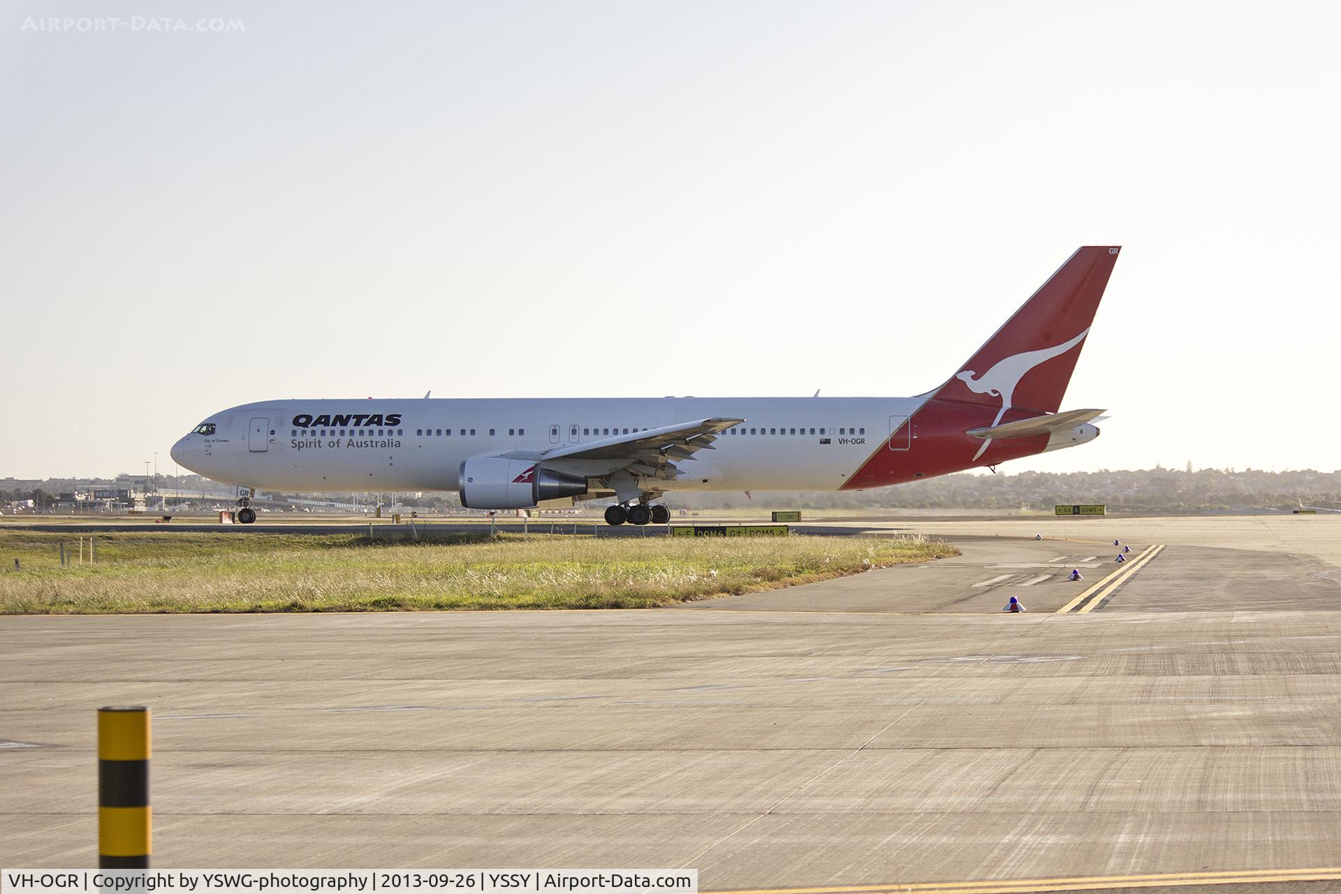 VH-OGR, 1997 Boeing 767-338 C/N 28724, Qantas (VH-OGR) Boeing 767-338ER waiting at Echo holding point at Sydney Airport.