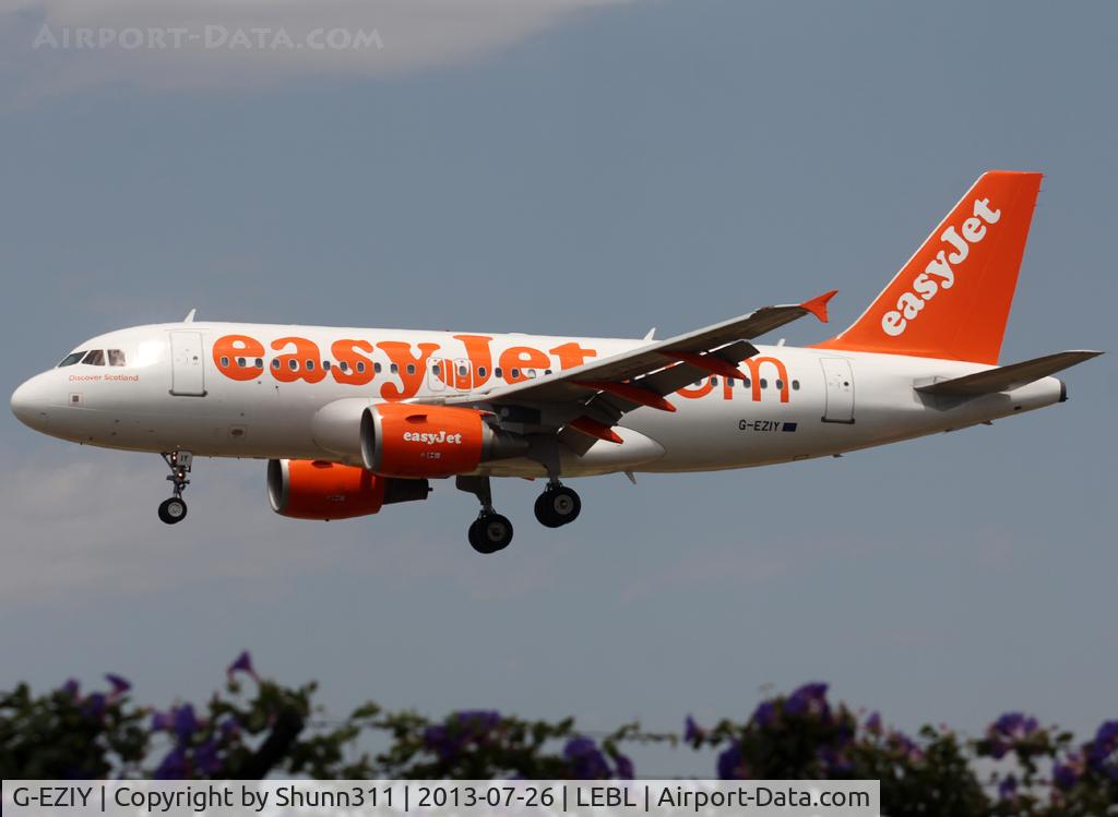 G-EZIY, 2005 Airbus A319-111 C/N 2636, Landing rwy 25R with additional small 'Discover Scotland' titles