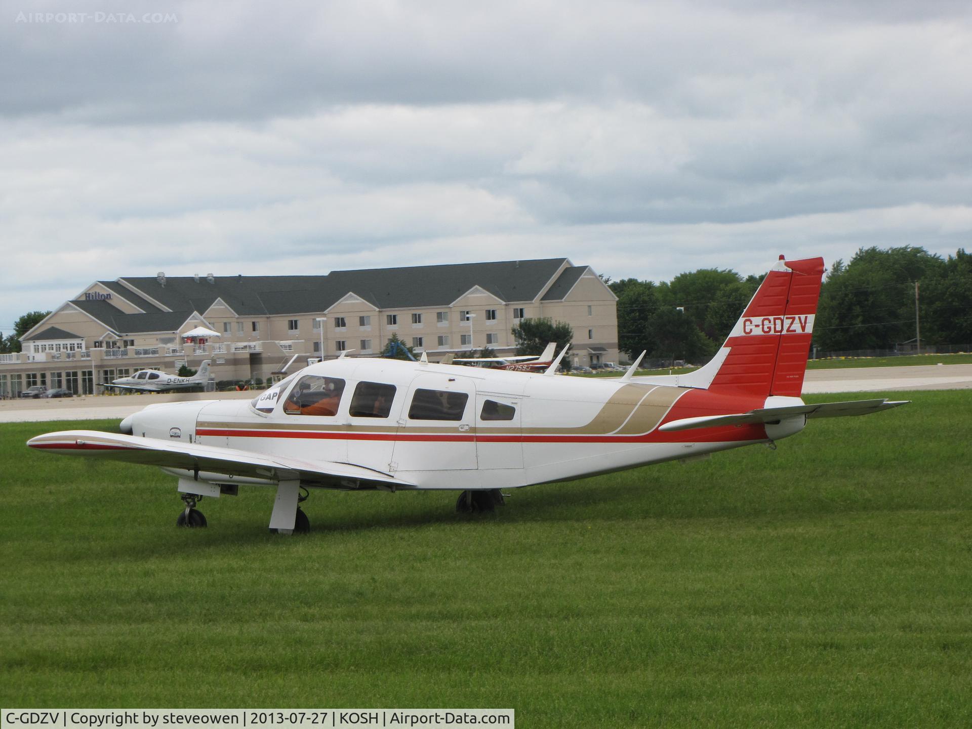 C-GDZV, 1976 Piper PA-32R-300 Cherokee Lance C/N 32R7680241, taxing in the grass at KOSH