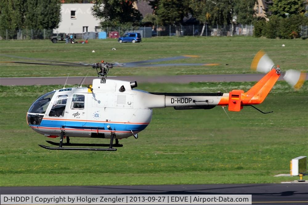D-HDDP, 1973 MBB Bo.105C C/N S-123, Floating westwards over taxiway.....