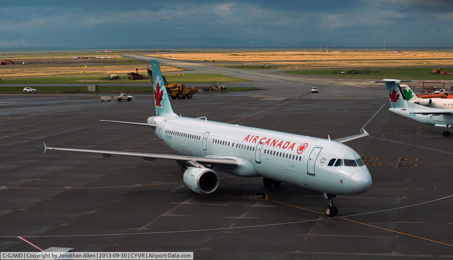 C-GJWD, 2002 Airbus A321-211 C/N 1748, Arriving at domestic terminal, Vancouver International airport.