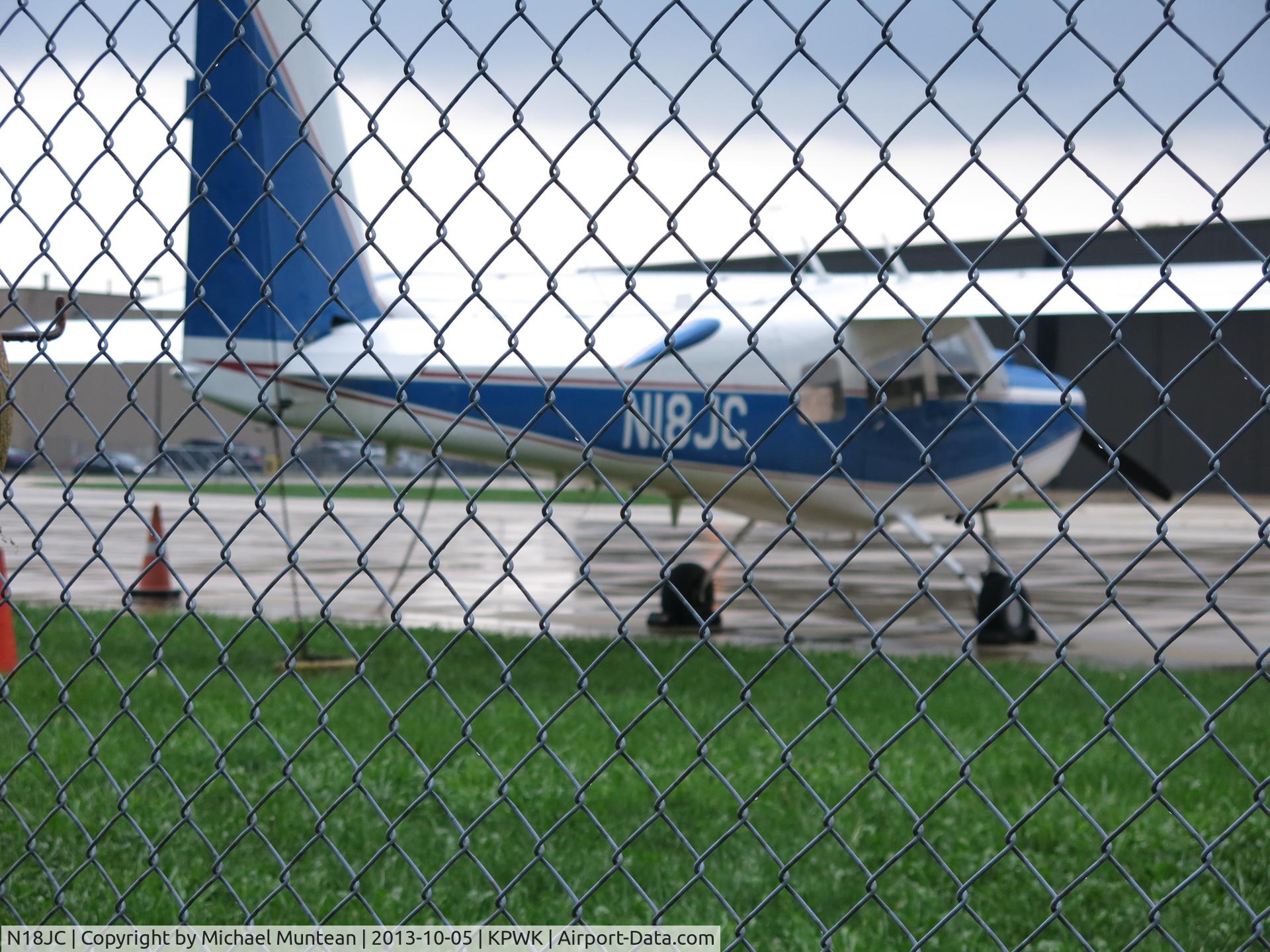 N18JC, 1974 Helio HT-295 Super Courier C/N 1719, Photographed on tarmac at Signature Flight Support at Chicago Executive