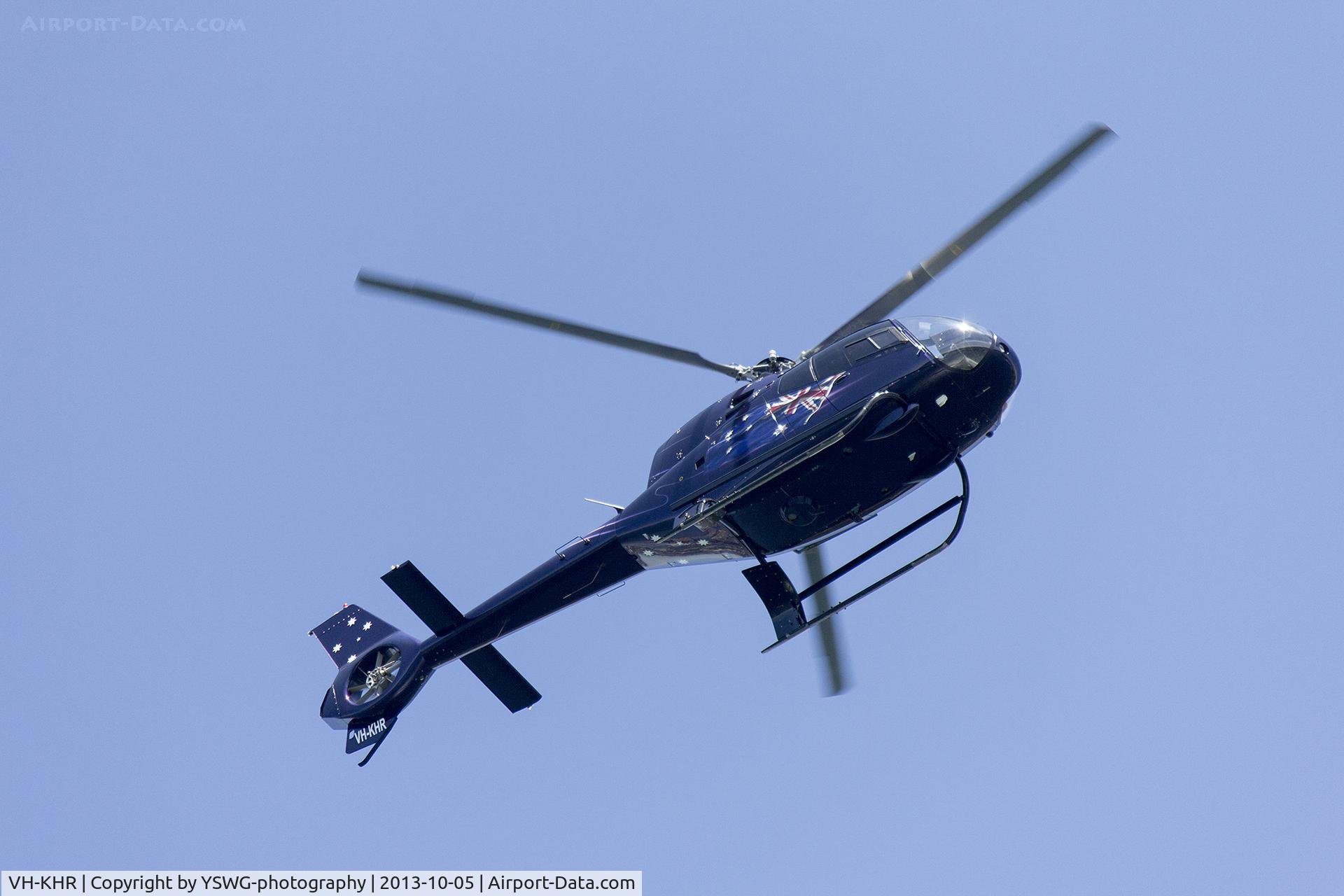 VH-KHR, 2006 Eurocopter EC-120B Colibri C/N 1435, Eurocopter EC120B (VH-KHR) flying over Sydney Harbour during the International Fleet Review 2013.