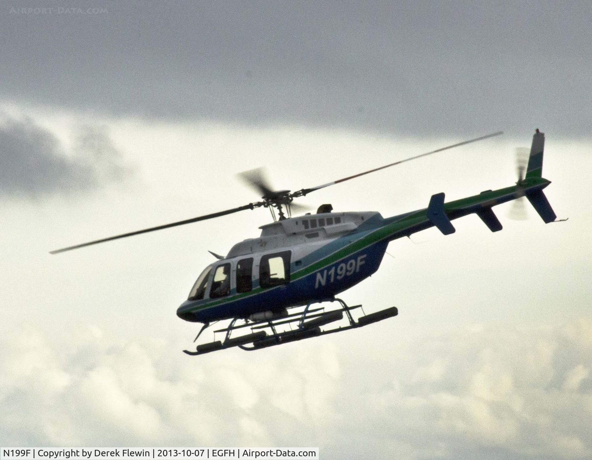 N199F, 2003 Bell 407 C/N 53574, Visiting Bell 407 seen departing to the East.