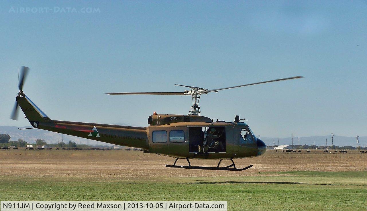 N911JM, 1965 Bell UH-1H C/N 65-09870, Lift off from Woodland/Davis Aero Modeler's Field