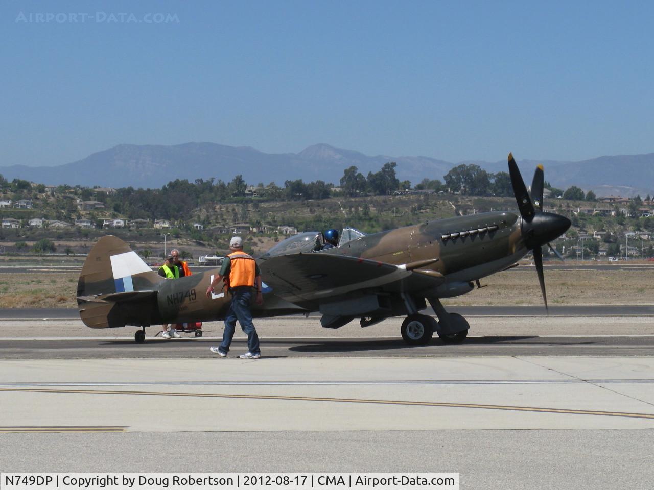 N749DP, 1945 Supermarine Spitfire XIV C/N 6S/583887, 1983 Vickers/Supermarine SPITFIRE Mk XIV, Rolls Royce Griffon 65 V-12 2.050 Hp, on flight line