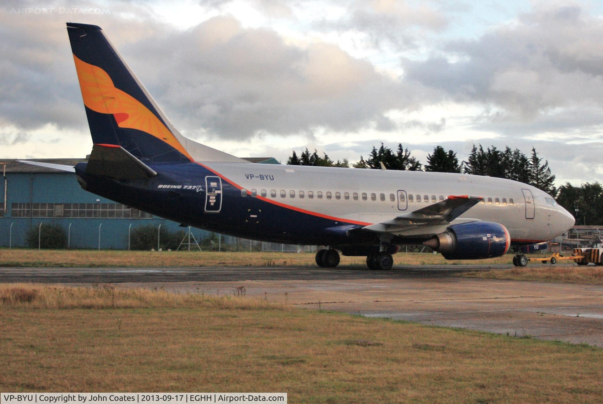VP-BYU, 1991 Boeing 737-5Q8 C/N 25167, Being towed onto European apron in setting sunlight.