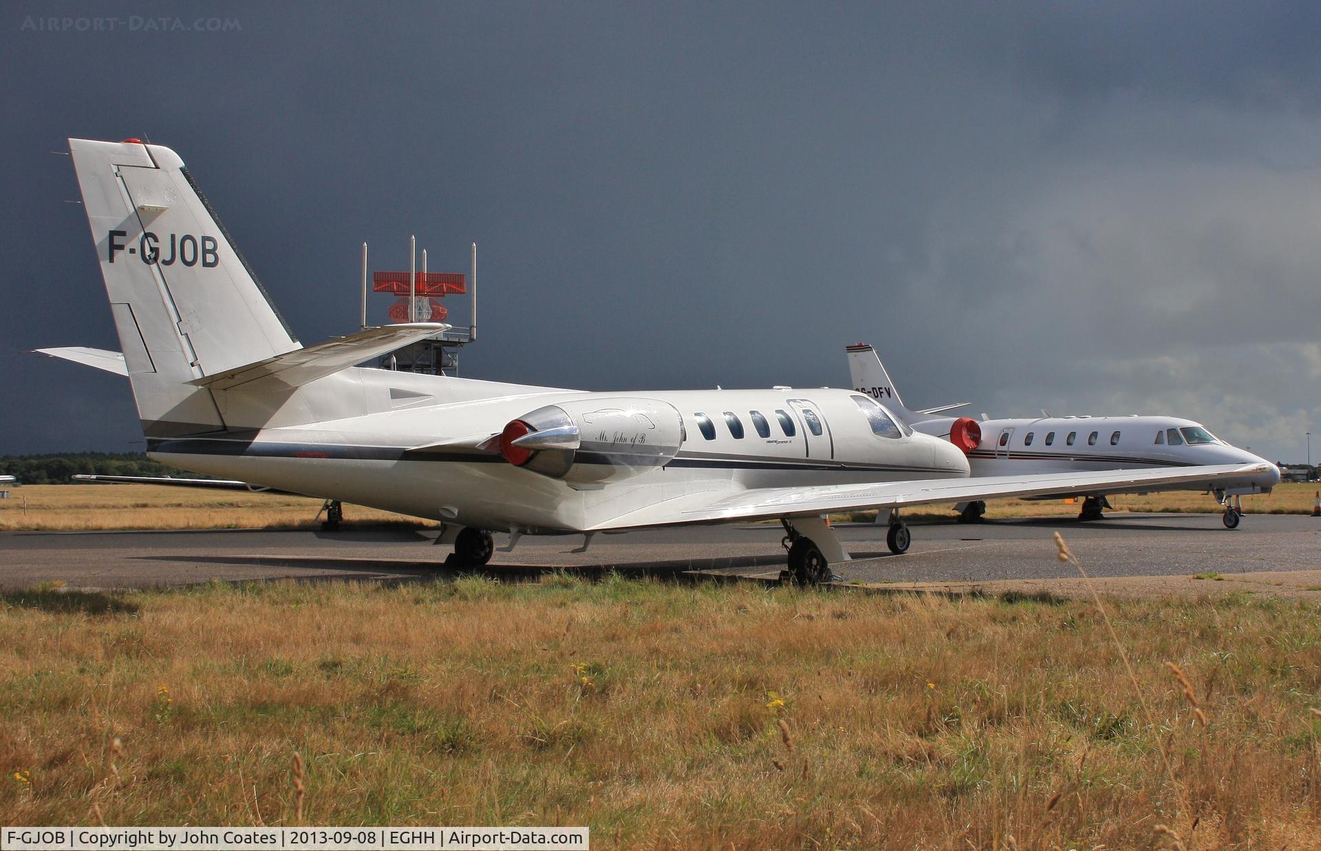 F-GJOB, 1980 Cessna 551 Citation II SP C/N 551-0174, At CSE with angry sky.