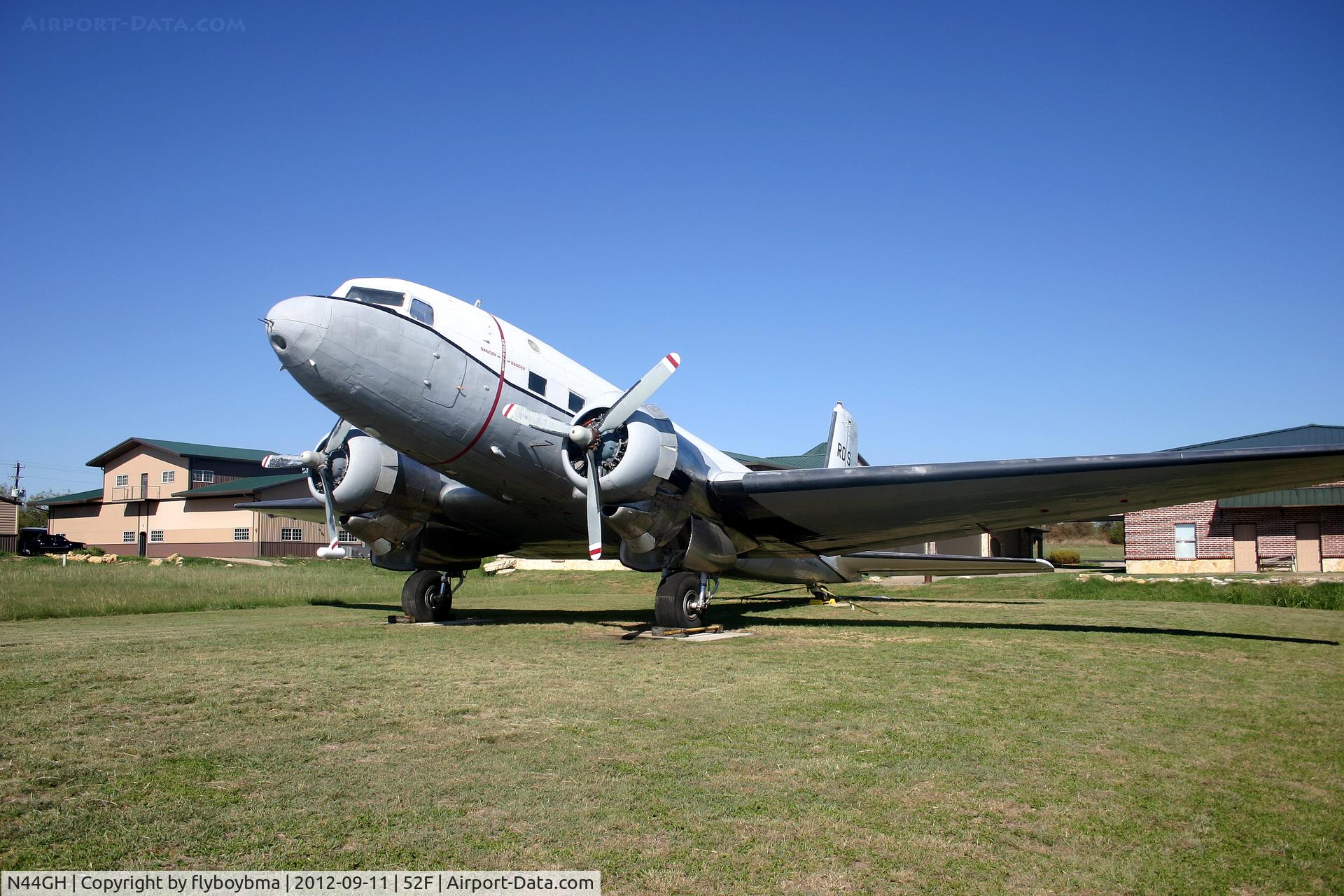 N44GH, 1952 Douglas Super R4D-8 C/N 43393, Sitting in the grass on the east side of the airport.
