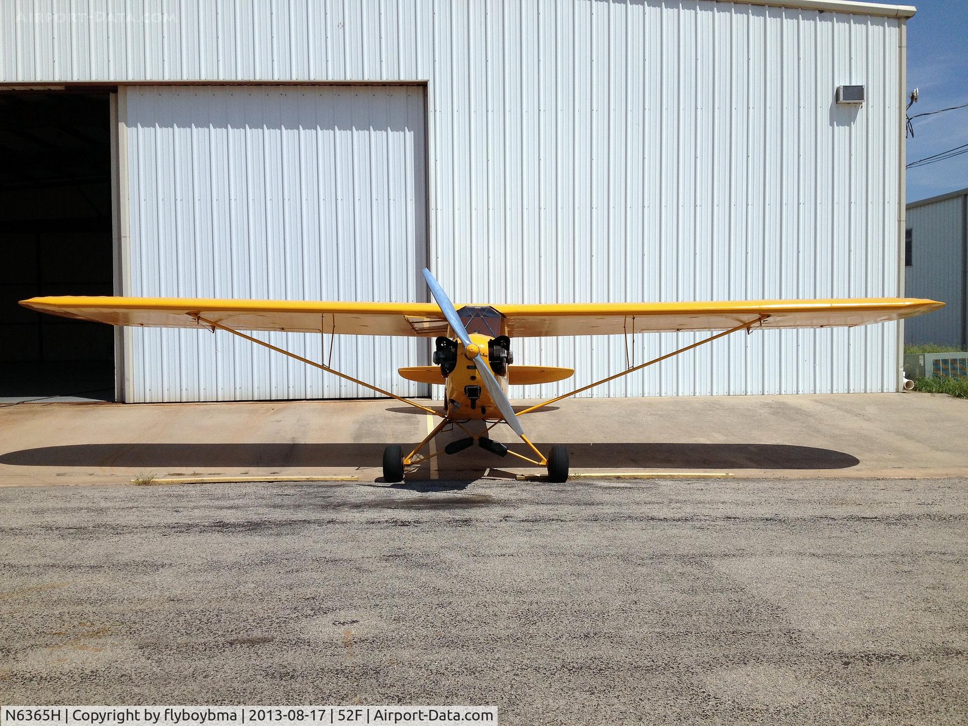 N6365H, 1946 Piper J3C-65 Cub C/N 19545, Sitting in front of a hangar, head on shot.