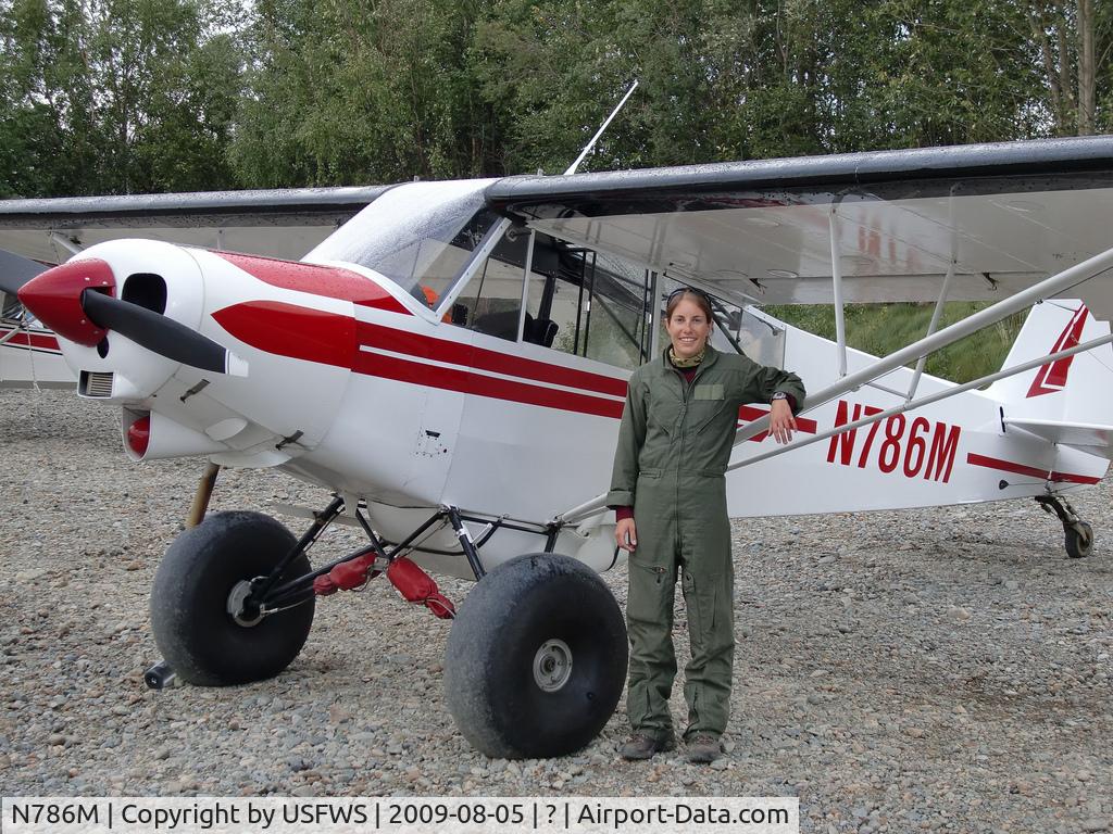 N786M, 1970 Piper PA-18-150 Super Cub C/N 18-8898, Arctic Refuge Law Enforcement Officer Heather Bartlett stands alongside the Super Cub she flies over wide expanses of Alaska as the U.S. Fish and Wildlife Service’s only female pilot/law enforcement officer. (USFWS)