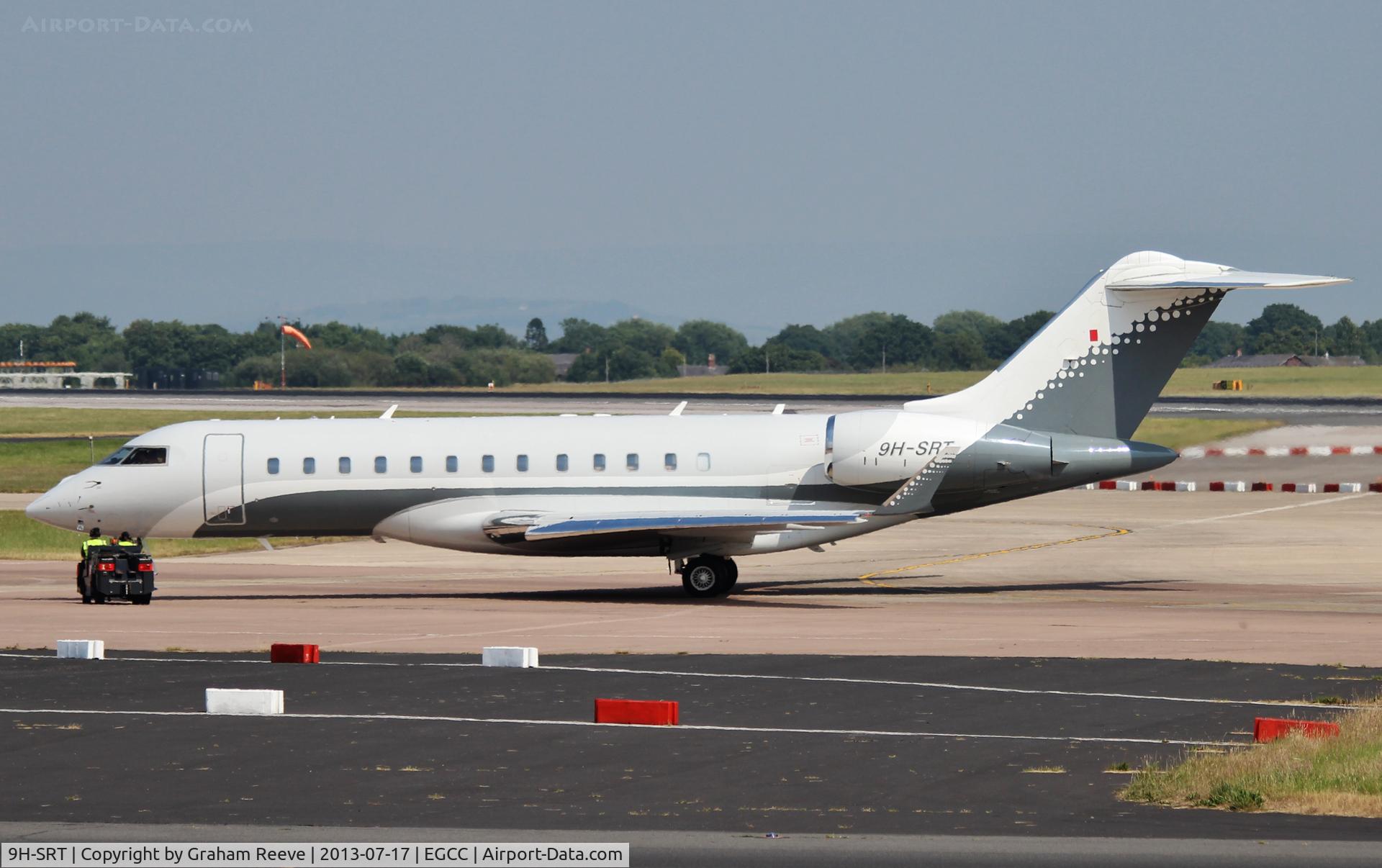 9H-SRT, 2008 Bombardier BD-700-1A10 Global Express C/N 9274, Under tow at Manchester.
