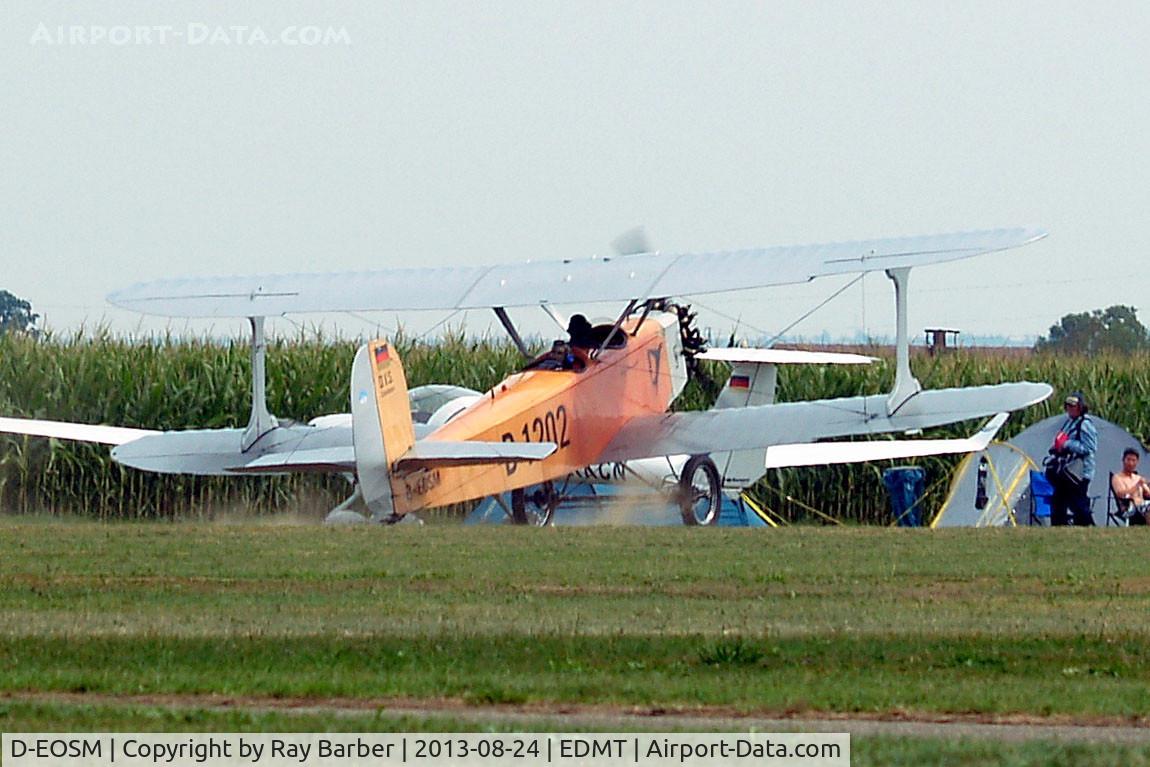D-EOSM, Udet U.12a Flamingo Replica C/N D-1202, Udet U.12a Flamingo (replica) [1785] (Flugwerft Schleissheim) Tannheim~D 24/08/2013.Still heading towards D-KKCN a photographer, tent and chap sitting in a chair.