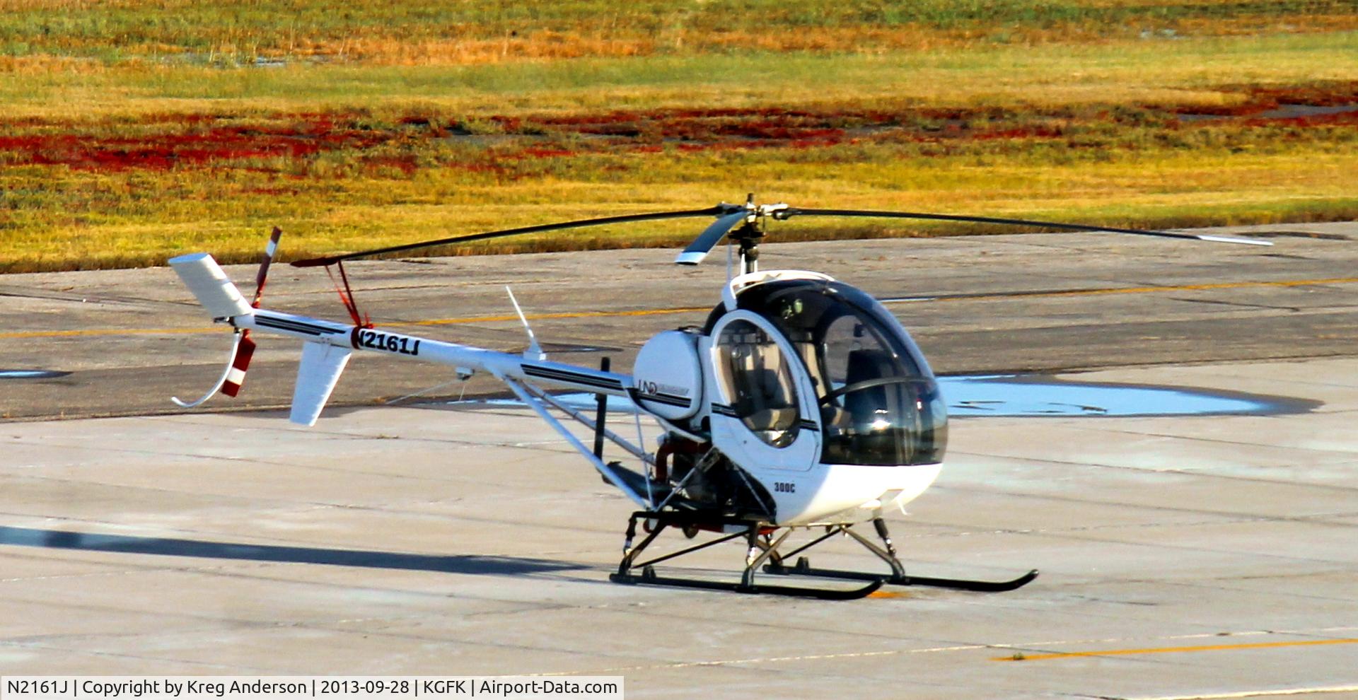N2161J, Schweizer 269C C/N S1947, University of North Dakota Schweizer 269C on the ramp.