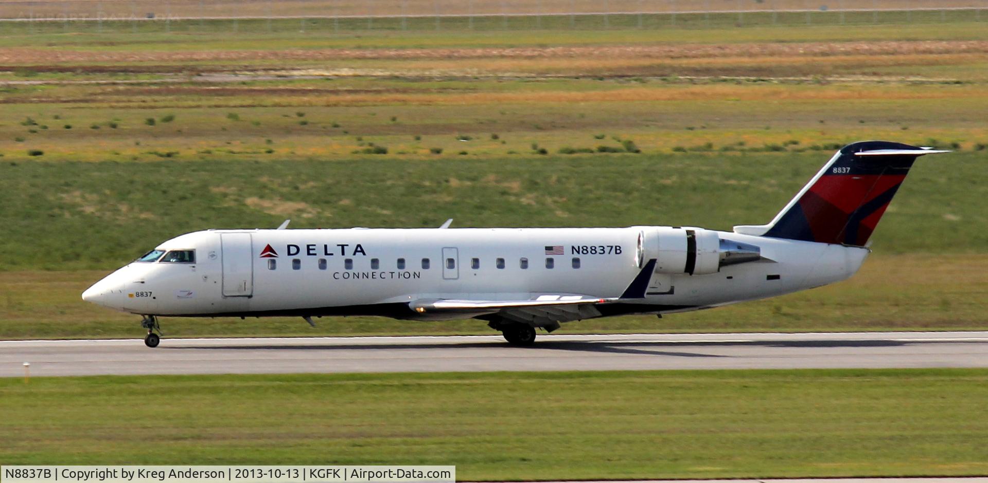 N8837B, 2003 Bombardier CRJ-200 (CL-600-2B19) C/N 7837, Delta Connection Bombardier CRJ-200 landing on runway 17R.