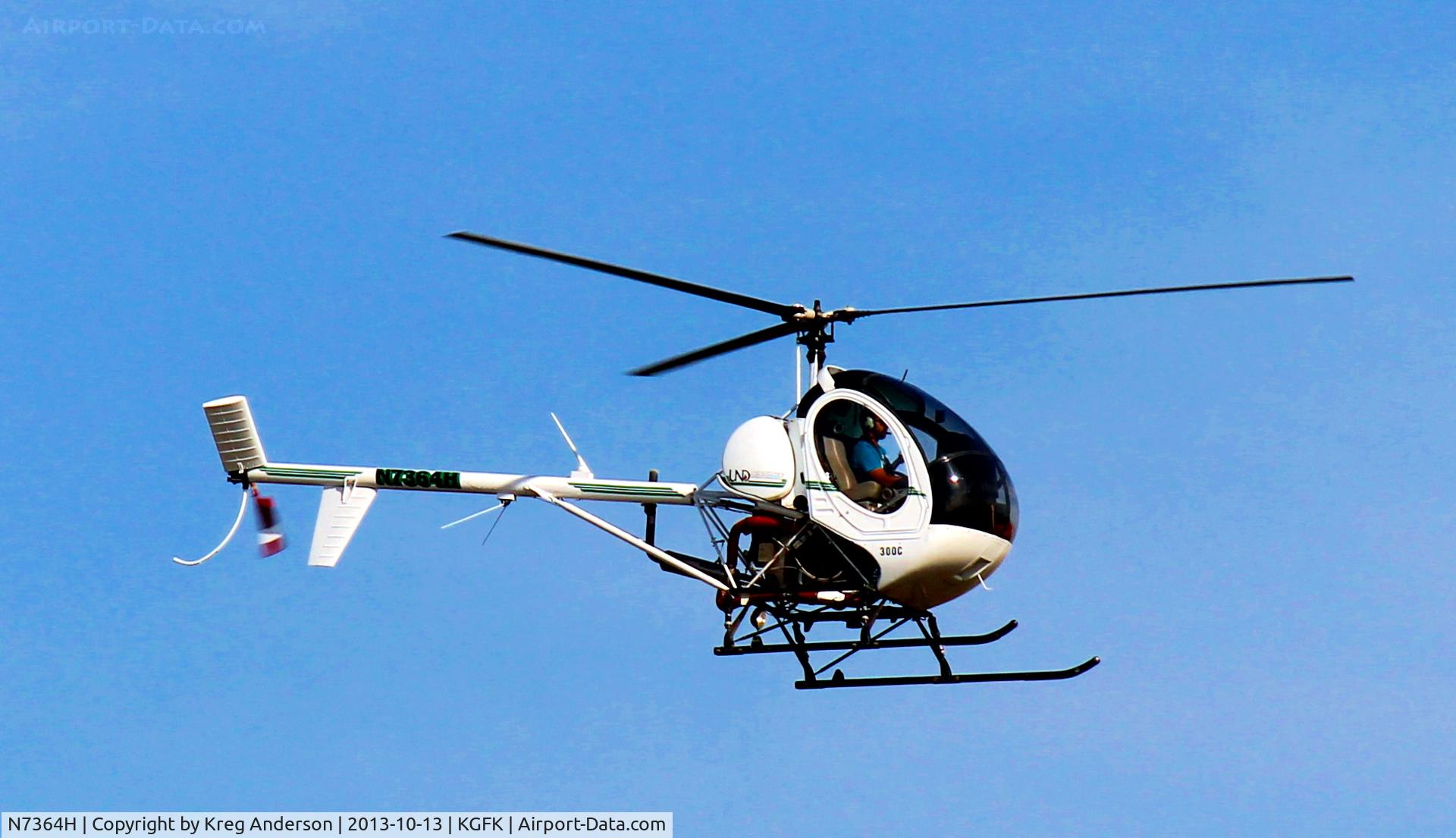 N7364H, Schweizer 269C C/N S1938, Schweizer 269C from the University of North Dakota landing back at GFK.