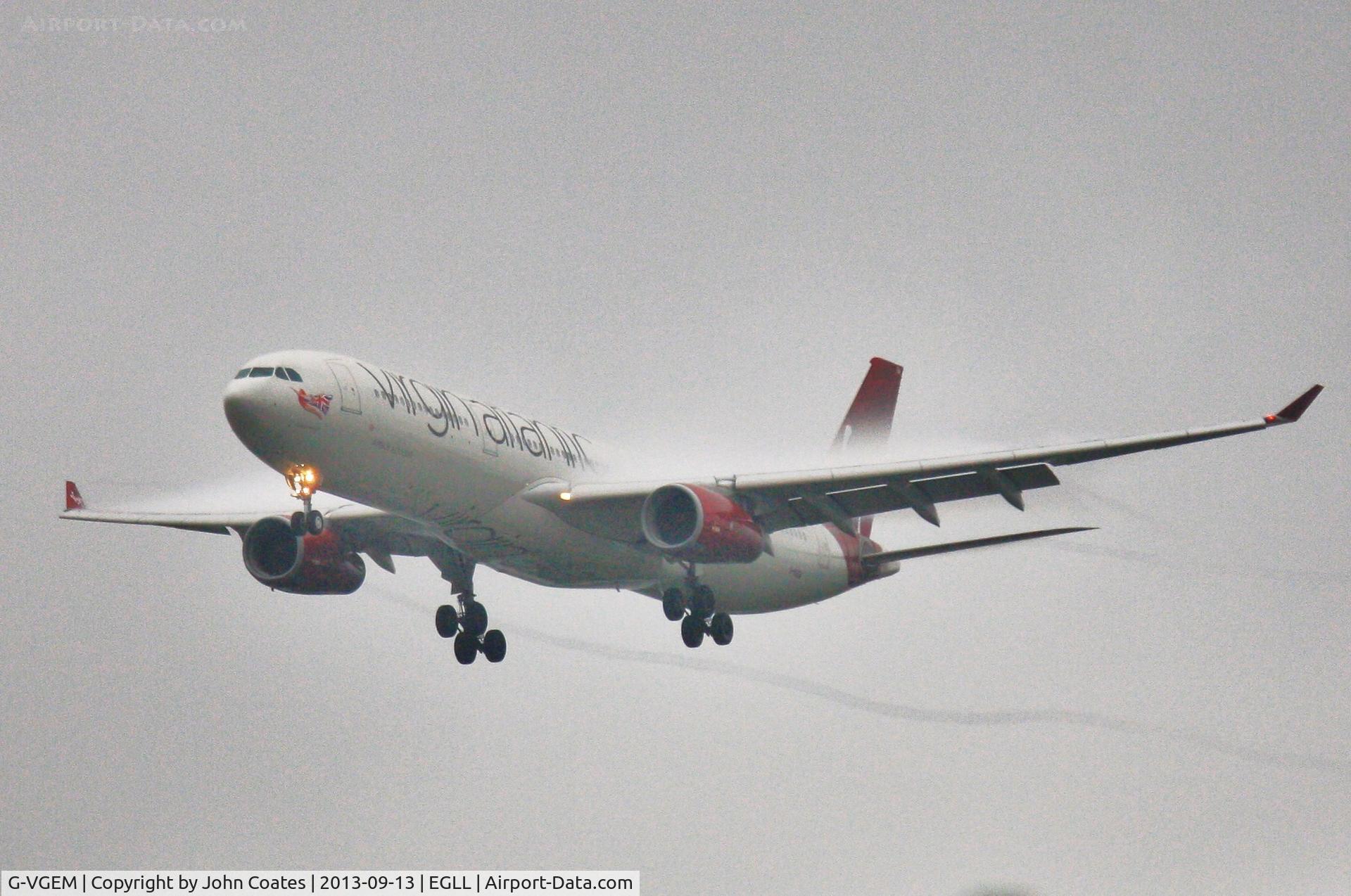 G-VGEM, 2011 Airbus A330-343X C/N 1215, Very wet finals to 27L.