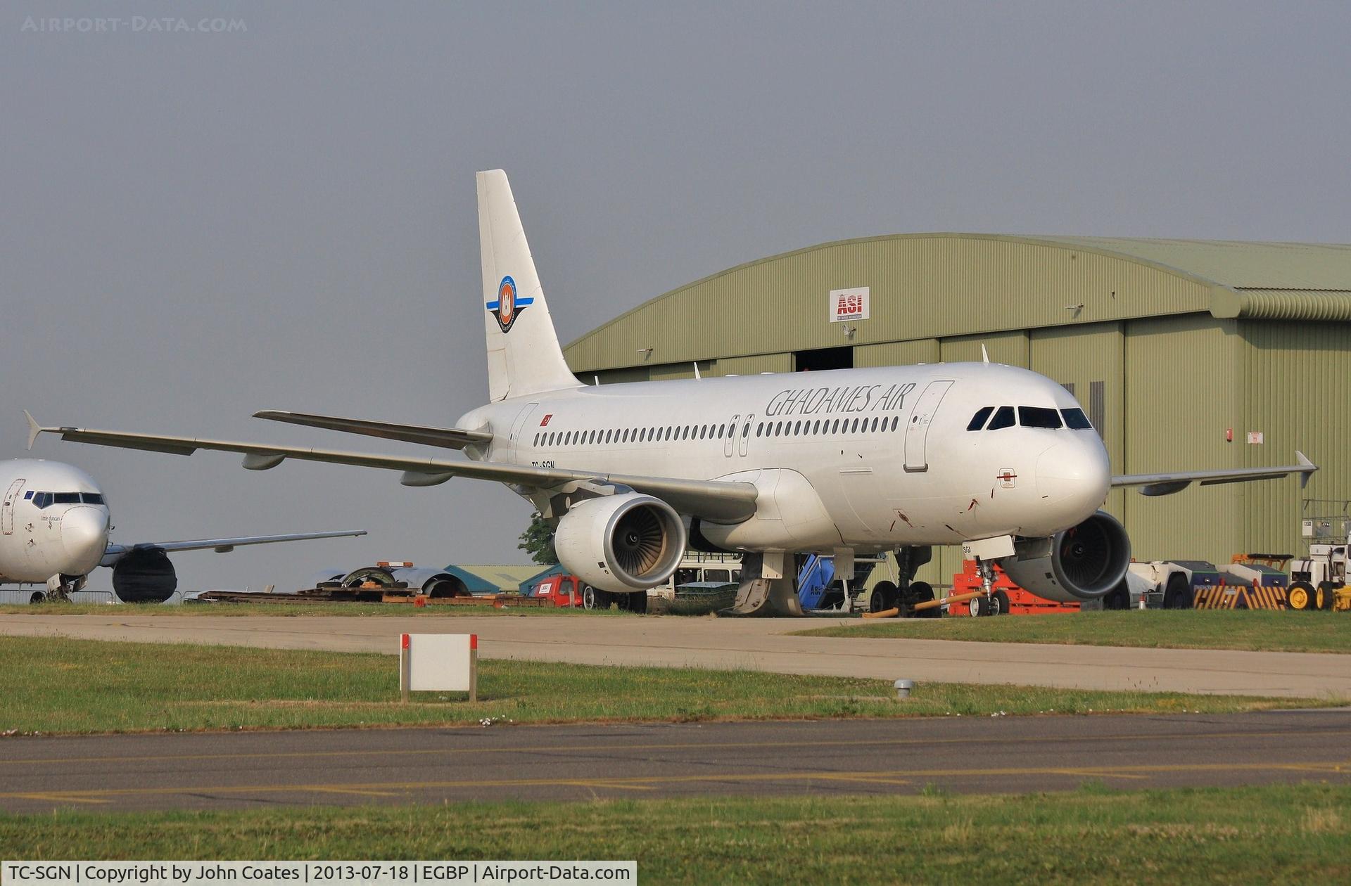TC-SGN, 2001 Airbus A320-214 C/N 1605, Ghadames Air livery, leased from SAGA and parked at ASI