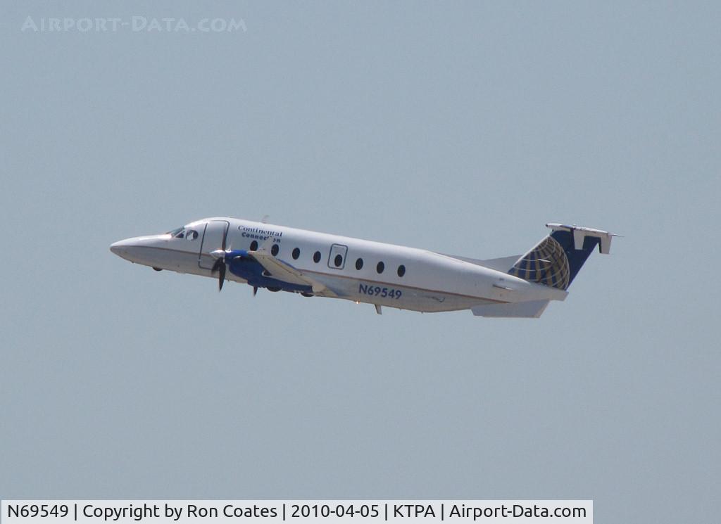 N69549, 1996 Beech 1900D C/N UE-194, This 1996 Beech 1900D climbs off rwy 36L at Tampa Int'l Airport