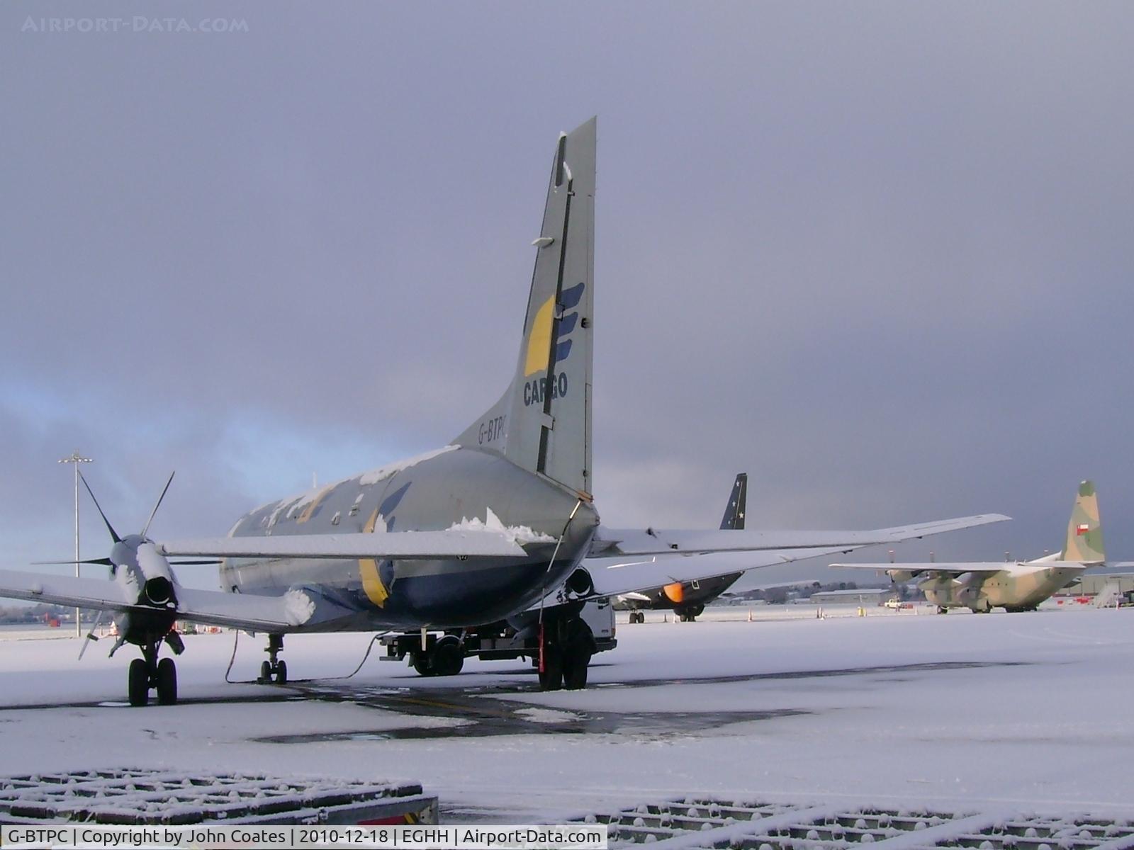 G-BTPC, 1988 British Aerospace ATP C/N 2010, On a snowy apron with Titan 737 and Royal Omani Air Force C130...not used to snow!