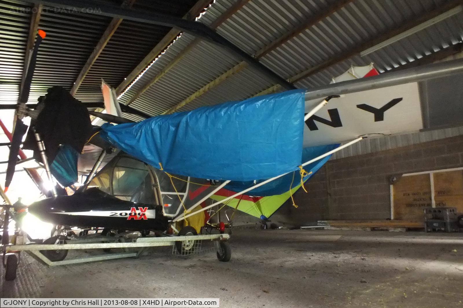 G-JONY, 1999 Cyclone AX2000 HKS C/N 7503, inside the packed hangar at Headon Airfield