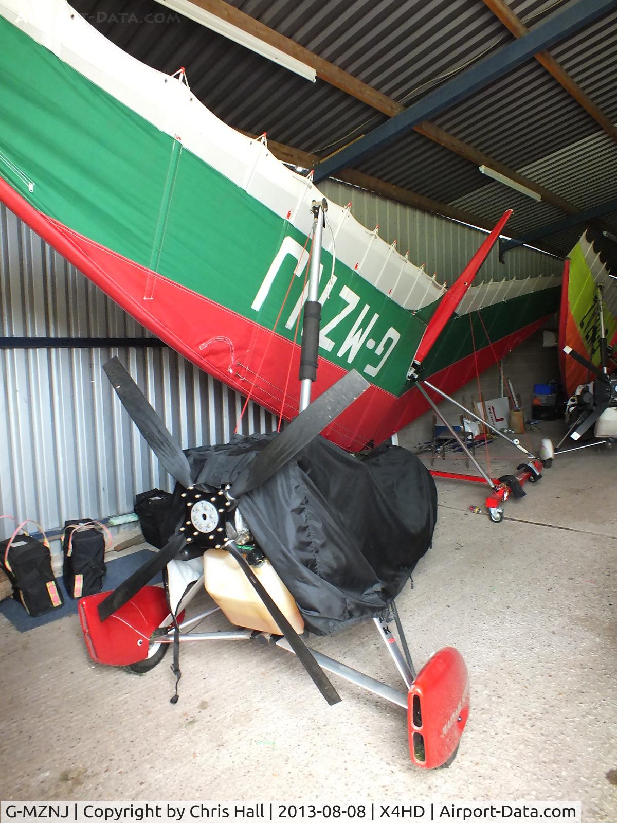 G-MZNJ, 1998 Mainair Blade C/N 1168-0798-7-W971, inside the packed hangar at Headon Airfield