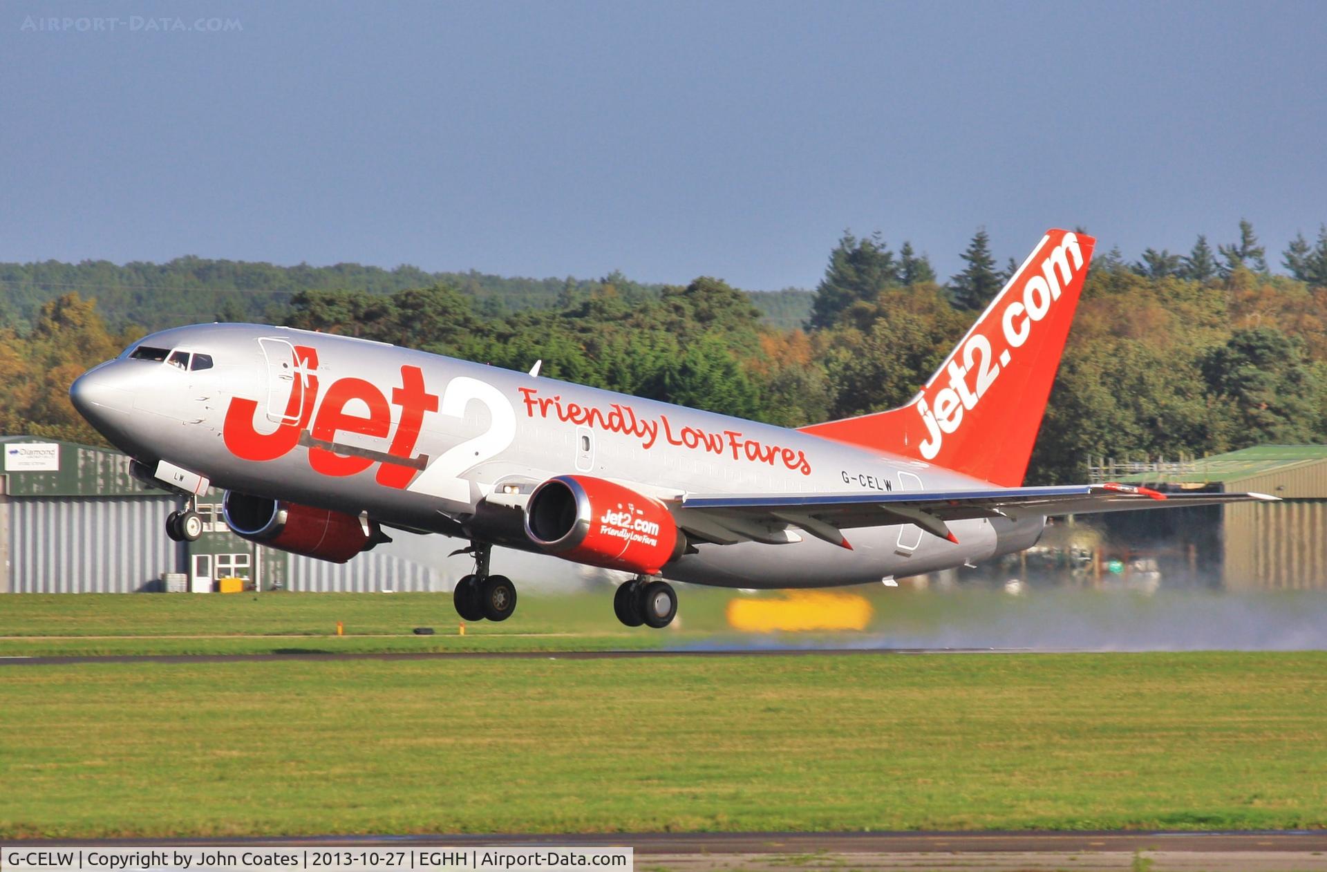 G-CELW, 1986 Boeing 737-377(SF) C/N 23659, Lifting off a wet 26 departing after respray