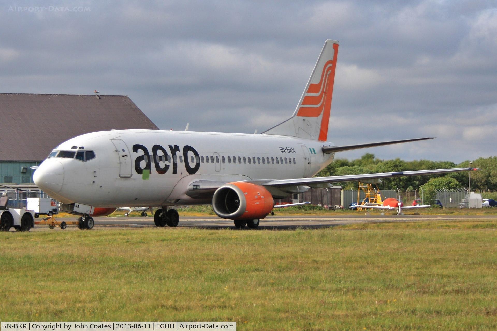 5N-BKR, 1993 Boeing 737-522 C/N 26699, Being towed to paintshop for repaint