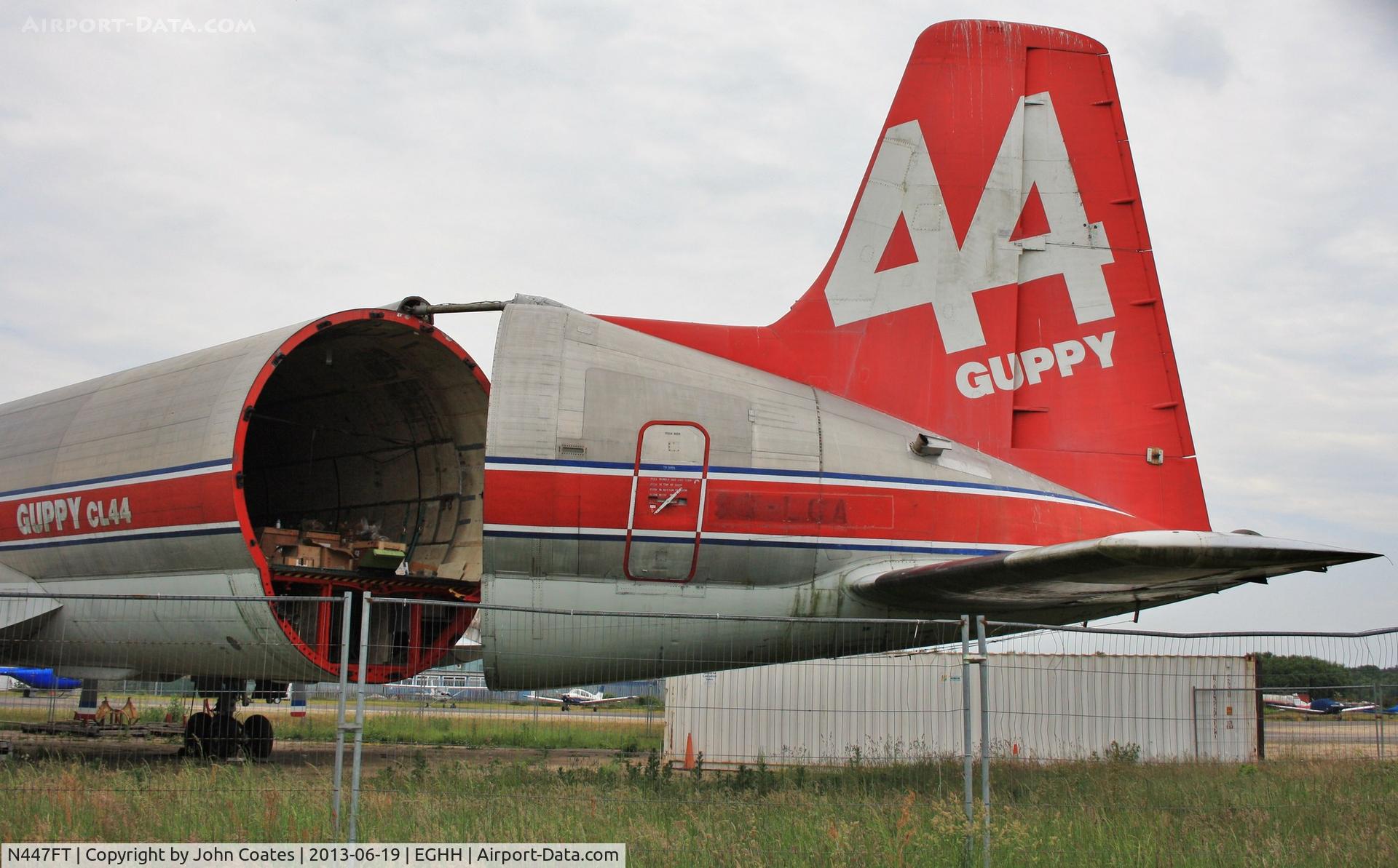 N447FT, 1969 Canadair CL-44-0 Skymonster C/N 16, Working on swing tail..previous reg 9G-LCA still visible