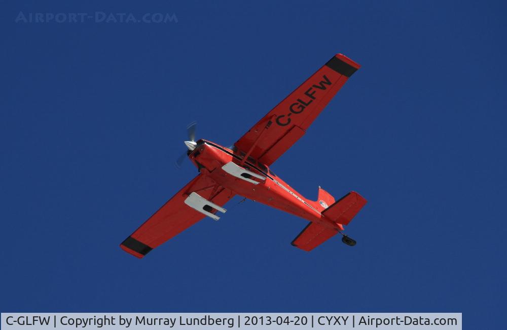 C-GLFW, 1975 Cessna 180J C/N 18052625, Landing at Whitehorse, Yukon, equipped with wheel-skis.