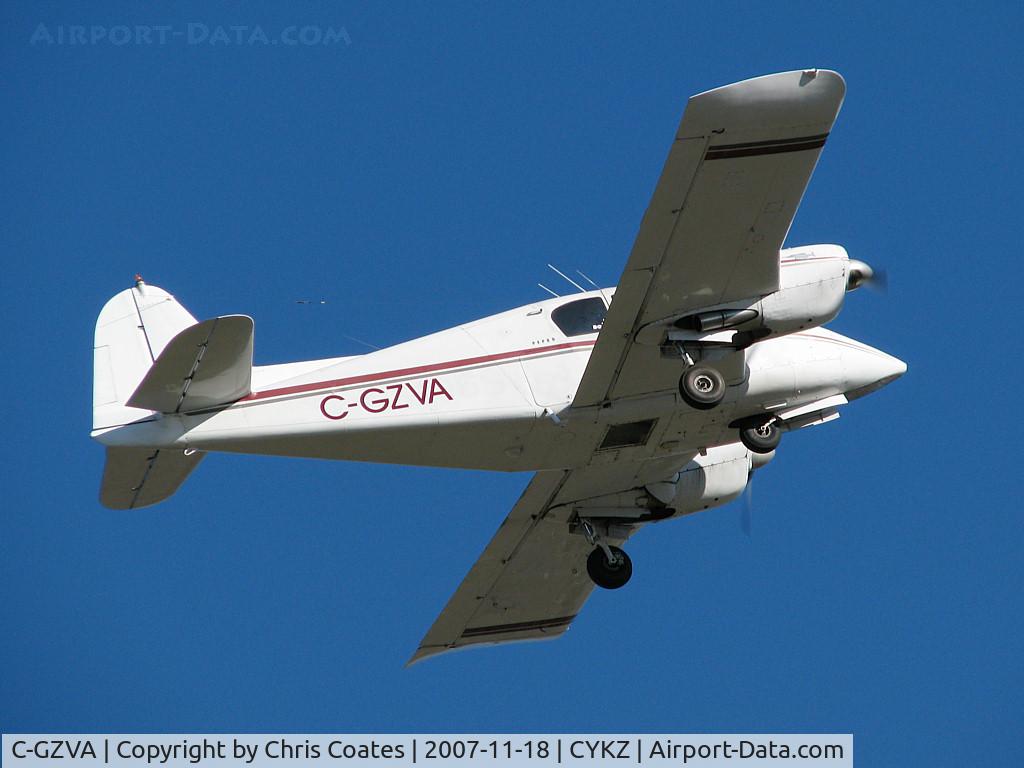 C-GZVA, 1956 Piper PA-23-250 Aztec C/N 23-466, This old Apache's landing gear was retracting after takeoff from runway 15. This was certainly a CAVU day ... Ceiling And Visibility Unlimited!