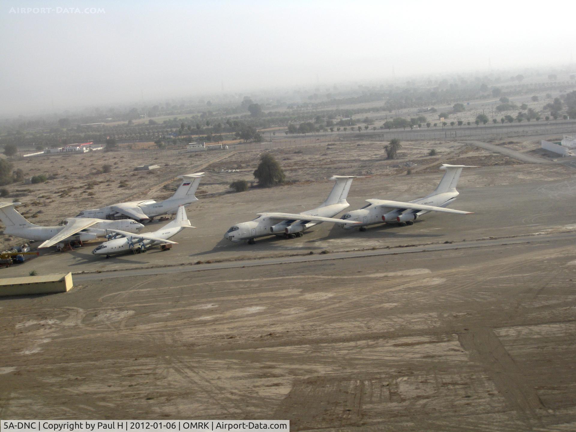 5A-DNC, Ilyushin IL76TD C/N 002347084, 4 Il-76 and an An-12 at the airfield of Ras Al Khaimah (RKT) in the UAE