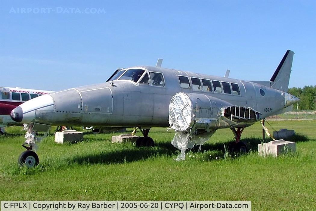 C-FPLX, 1968 Beech 99 C/N U-1, Beech 99 [U-1] Peterborough~C 20/06/2005. Stored here unmarked but painted on p/i of N212BH.