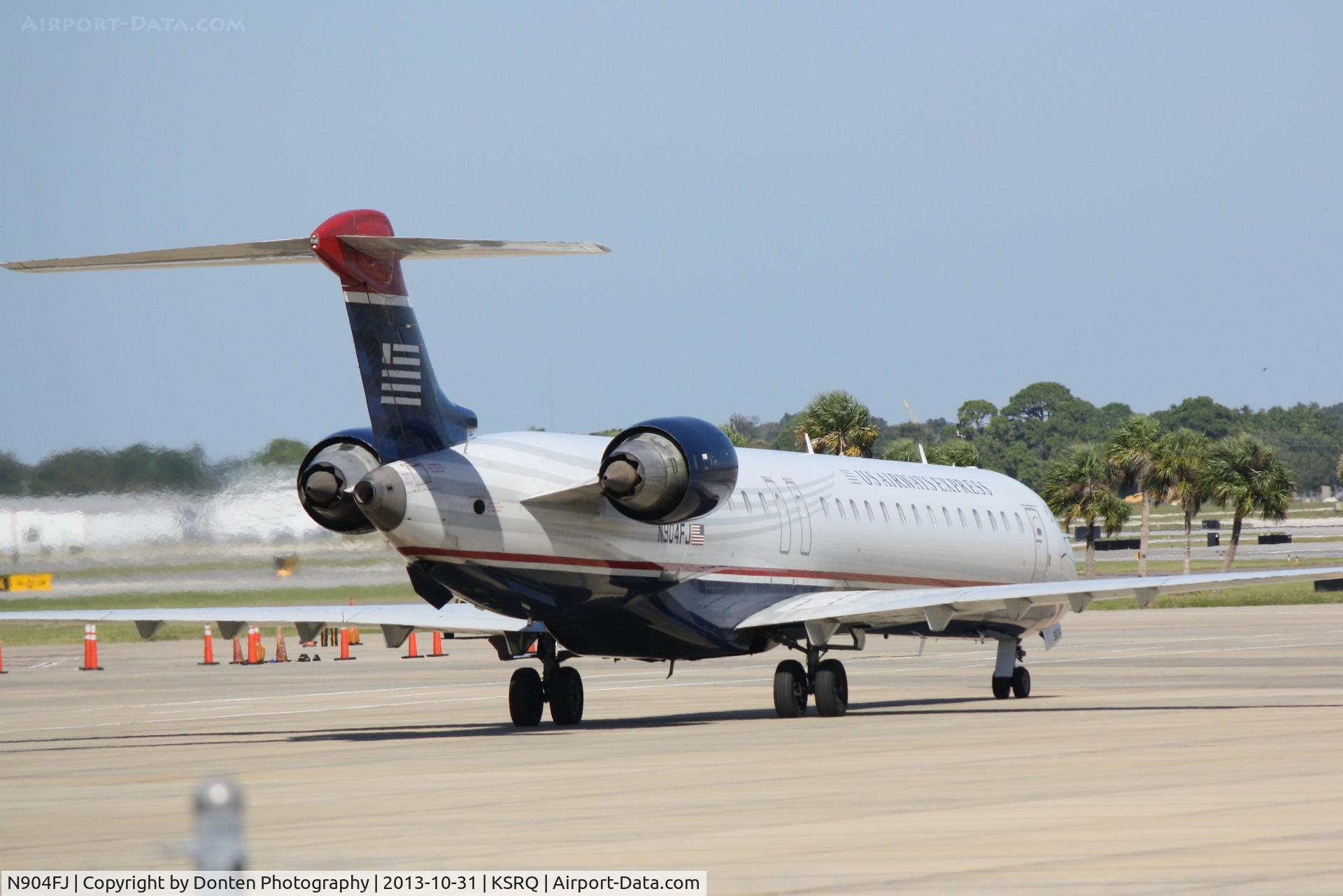 N904FJ, 2003 Bombardier CRJ-900ER (CL-600-2D24) C/N 15004, US Air 2884 operated by Mesa (N904FJ) prepares for flight at Sarasota-Bradenton International Airport