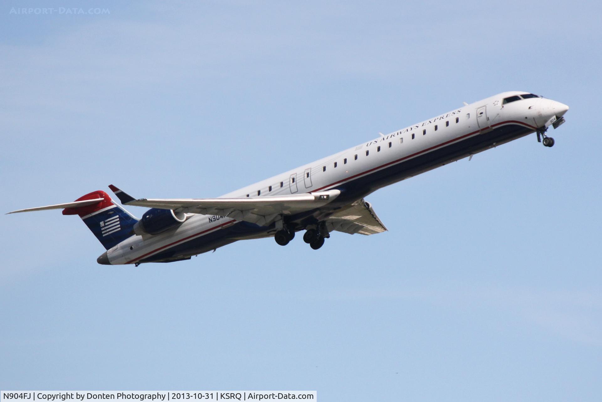 N904FJ, 2003 Bombardier CRJ-900ER (CL-600-2D24) C/N 15004, US Air 2884 operated by Mesa (N904FJ) departs Sarasota-Bradenton International Airport