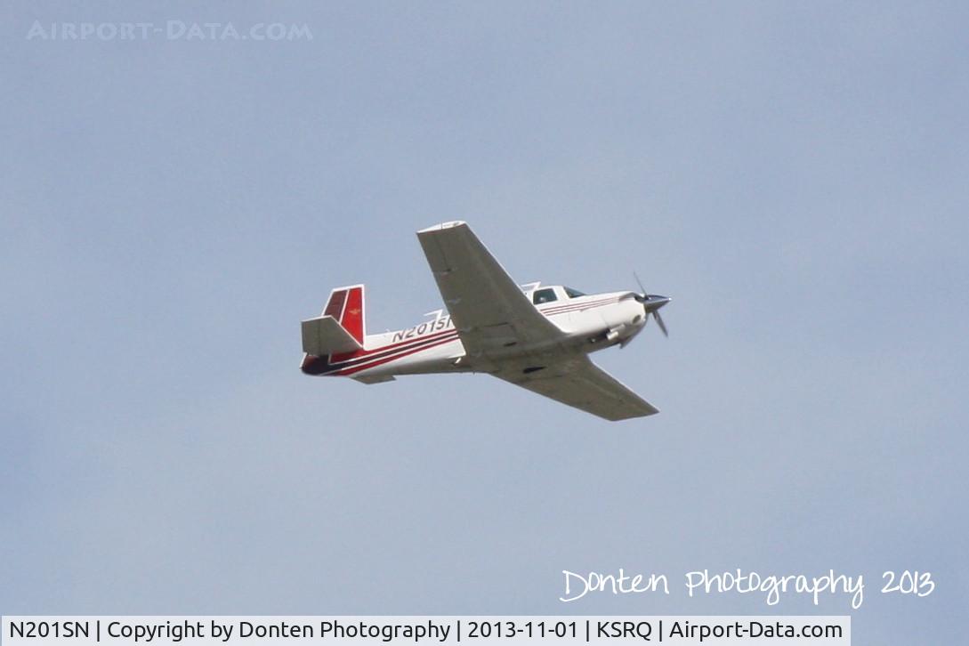 N201SN, 1977 Mooney M20J 201 C/N 24-0319, Mooney M-20 (N201SN) departs Sarasota-Bradenton International Airport