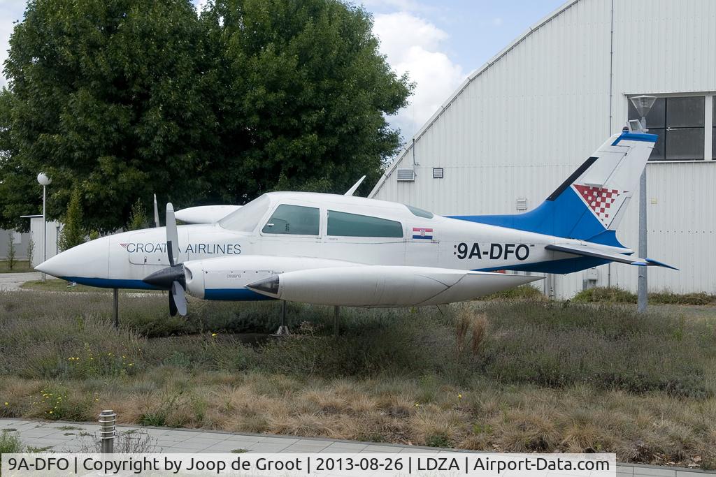 9A-DFO, Cessna 310R C/N 310R1537, now preserved as a gate guard at the airport