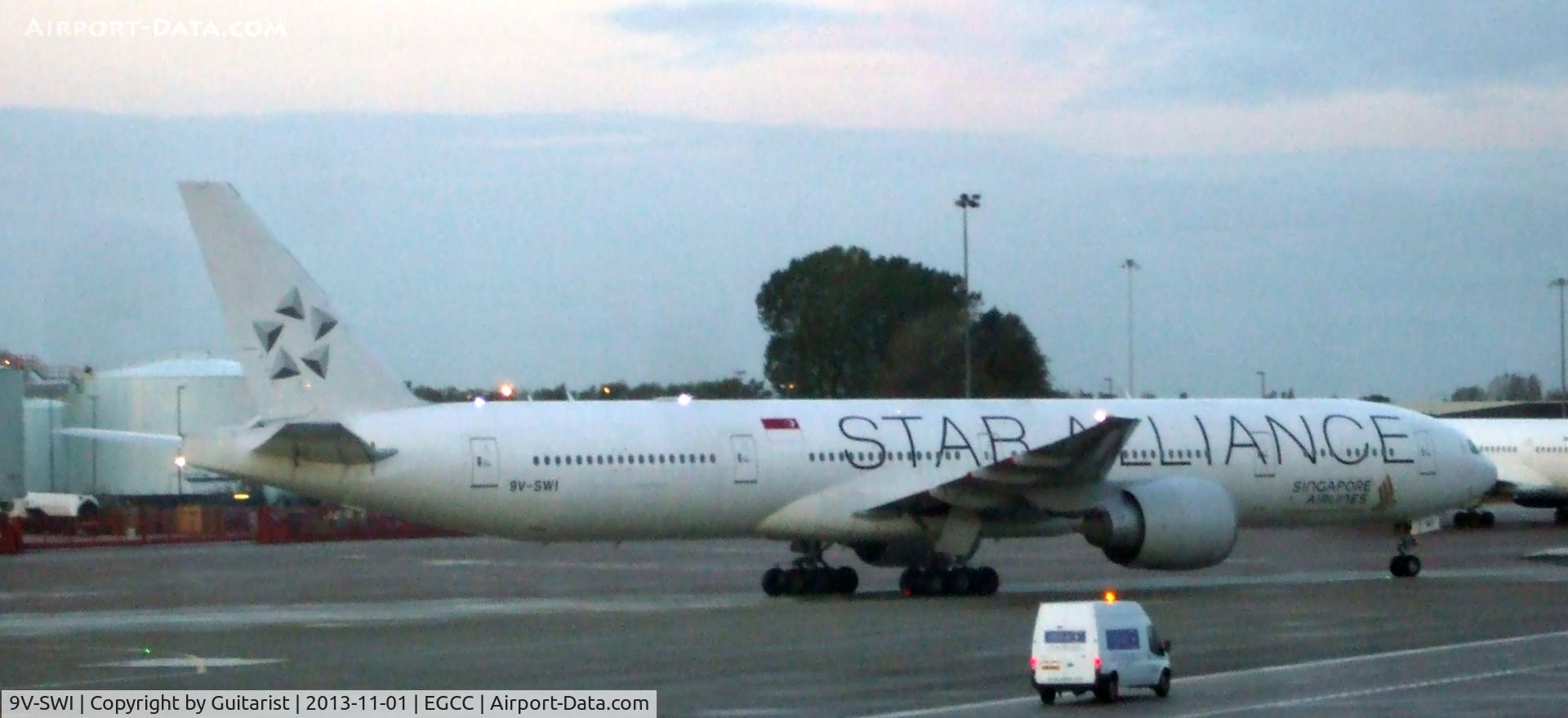 9V-SWI, 2007 Boeing 777-312/ER C/N 34574, Through the windows of T1 again at Manchester