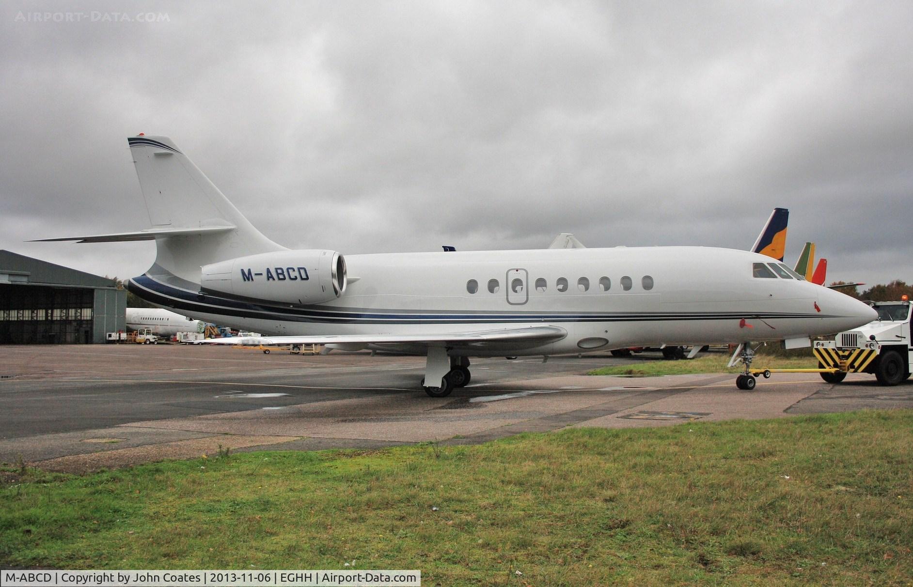 M-ABCD, 1999 Dassault Falcon 2000 C/N 98, Being towed away from Thurston Aviation