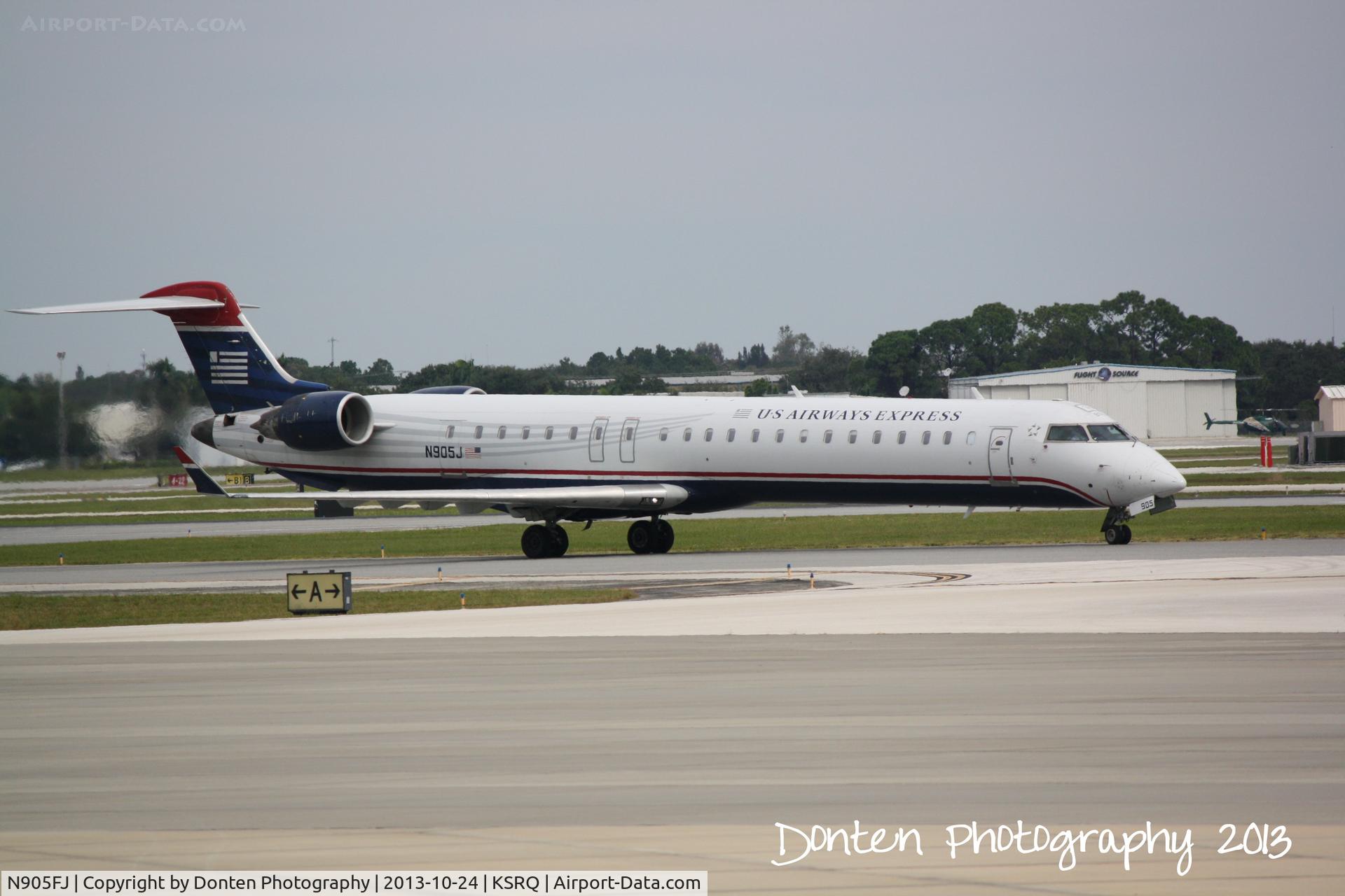 N905FJ, 2003 Bombardier CRJ-900 (CL-600-2D24) C/N 15005, US Air Flight 2675 operated by Mesa (N905FJ) arrives at Sarasota-Bradenton International Airport following a flight from Charlotte-Douglas International Airport