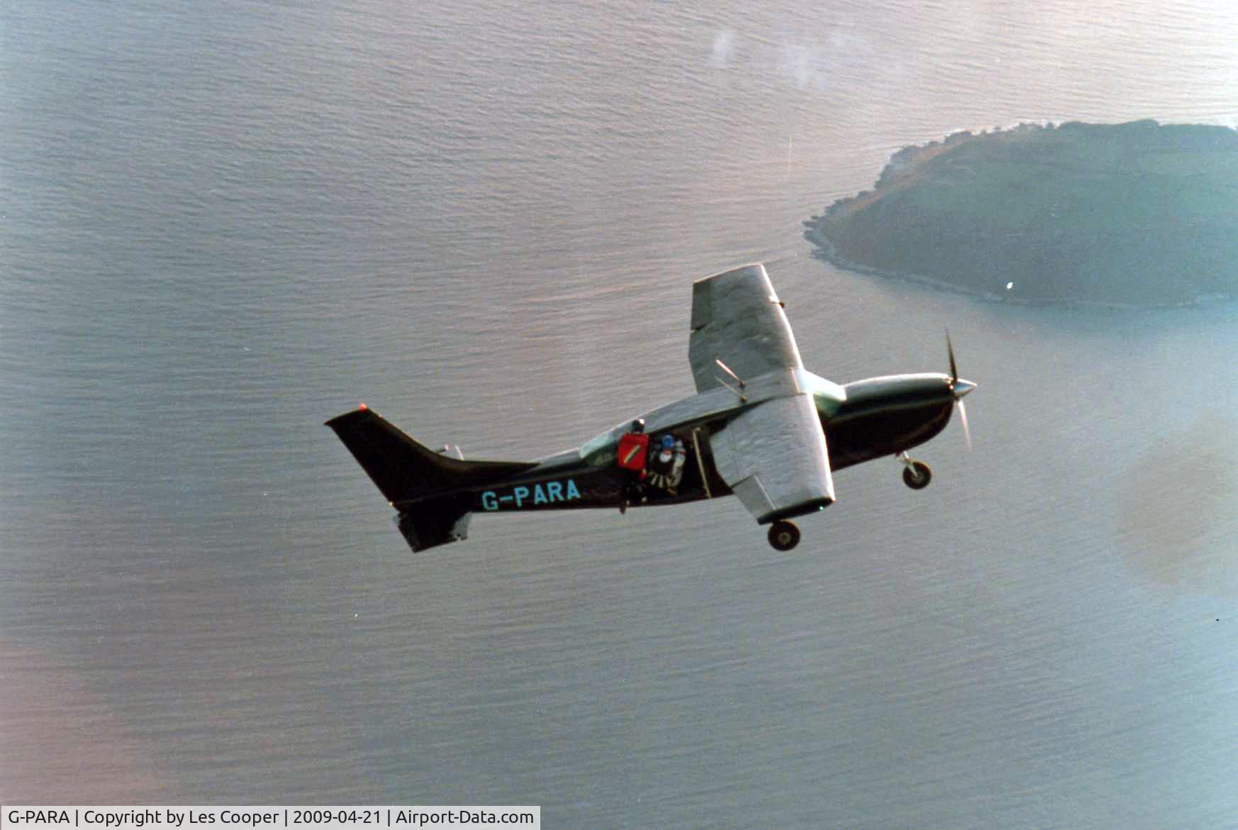 G-PARA, 1970 Cessna 207 Skywagon C/N 207-00153, Skydivers climb out of G-PARA over The Gower on the run-in to Swansea Parachute Club Drop Zone.