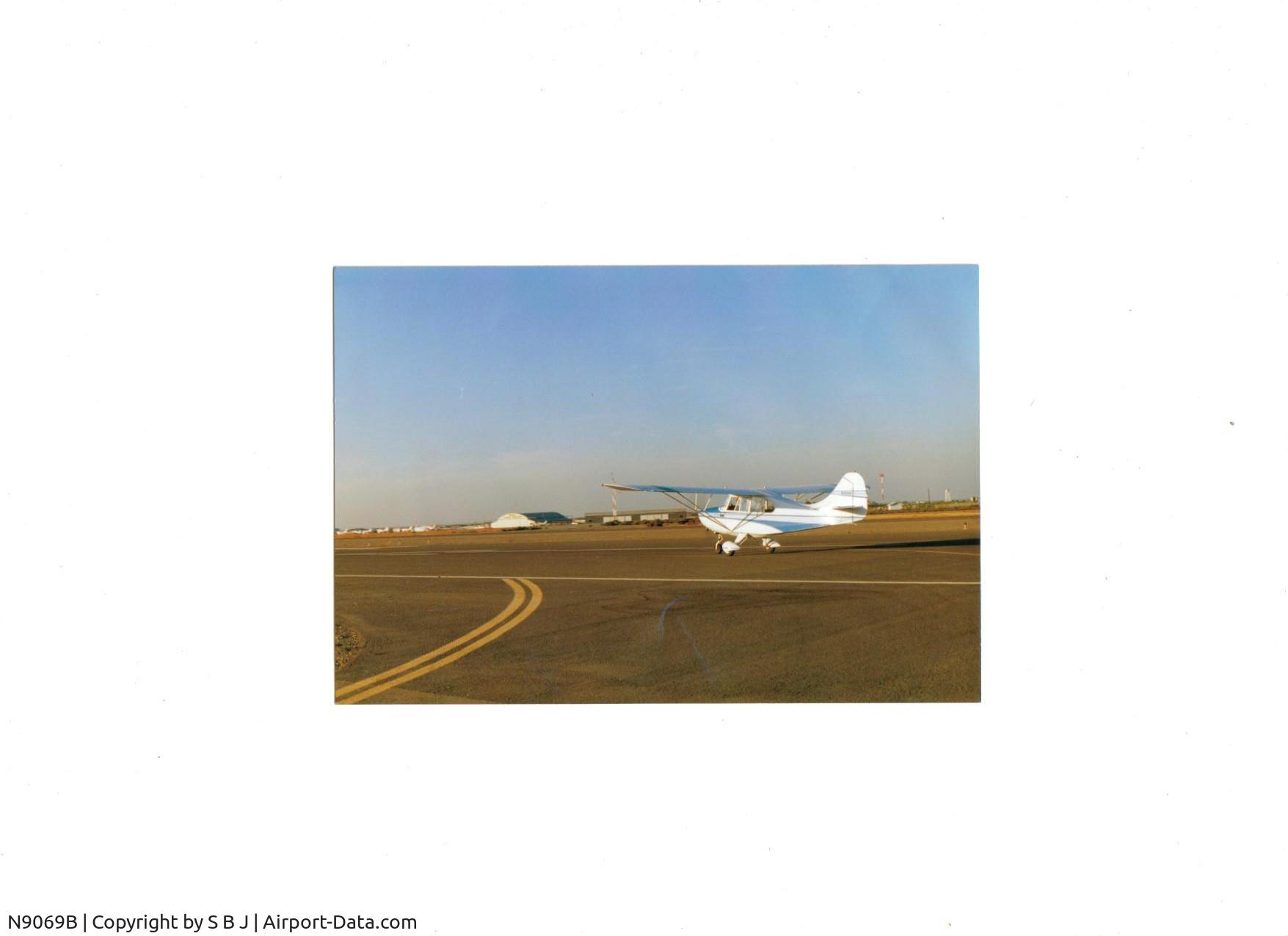 N9069B, 1958 Champion 7FC C/N 7FC-153, Owner Jim on take off at Tracy airport in 2000.