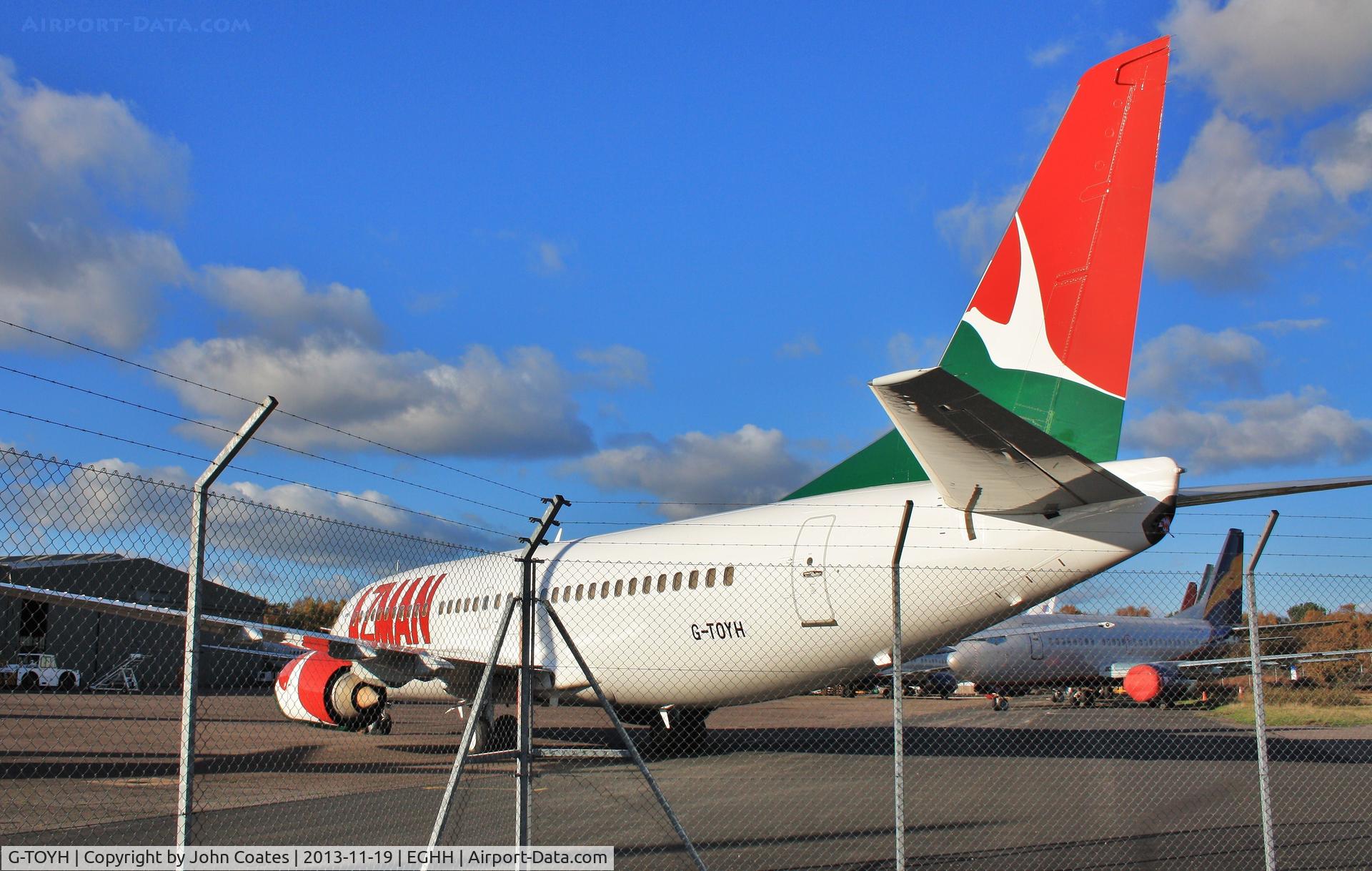 G-TOYH, 1998 Boeing 737-36N C/N 28570, Exiting workshop after attention.