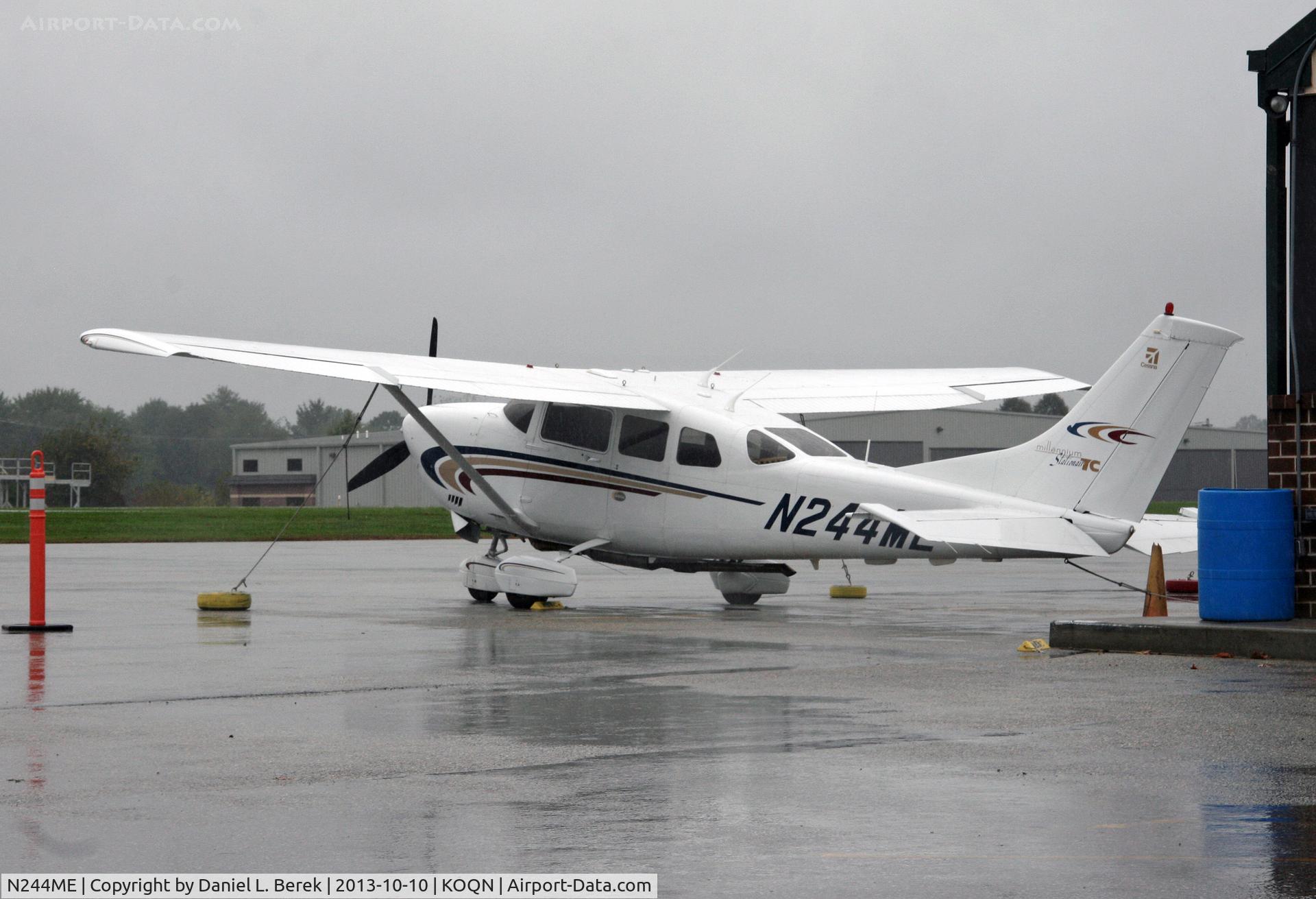 N244ME, 2000 Cessna T206H Turbo Stationair C/N T20608192, Powerful Cessna sits on rain-soaked apron at Brandywine Airport.