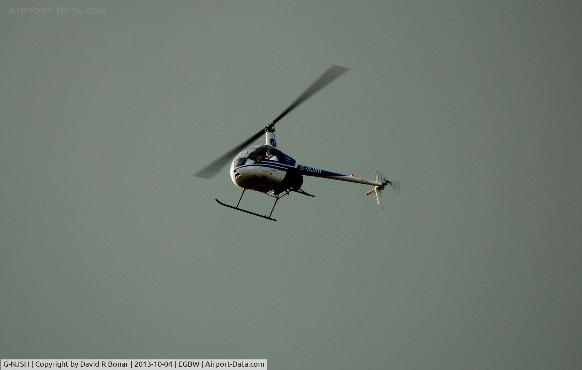 G-NJSH, 1988 Robinson R22 Beta C/N 0780, Doing circuits at Wellesbourne Mountford against a great sky